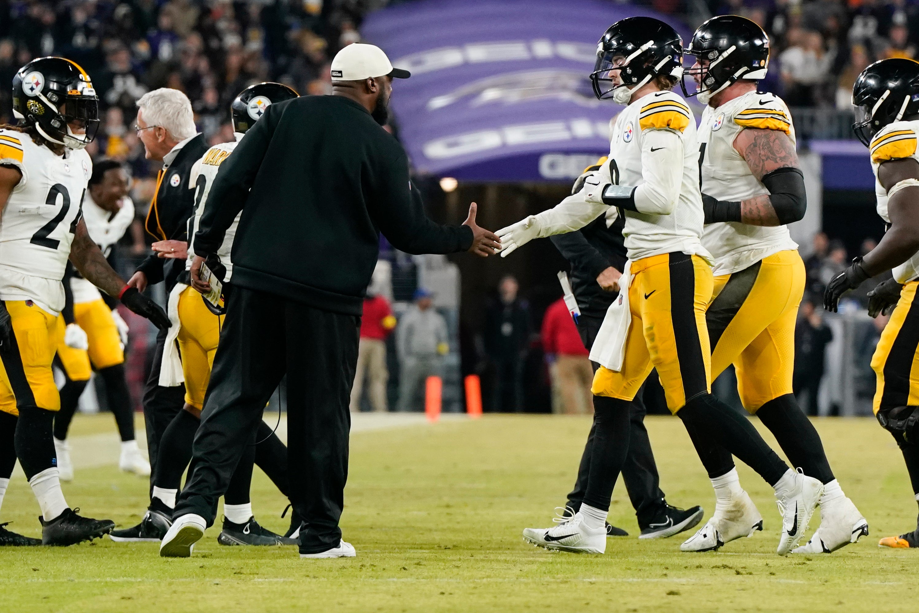 Jan 1, 2023; Baltimore, Maryland, USA; Pittsburgh Steelers head coach Mike Tomlin and quarterback Kenny Pickett (8) shake hands after the team scores the game-winning touchdown against the Baltimore Ravens during the second half at M&T Bank Stadium. Mandatory Credit: Jessica Rapfogel-USA TODAY Sports
