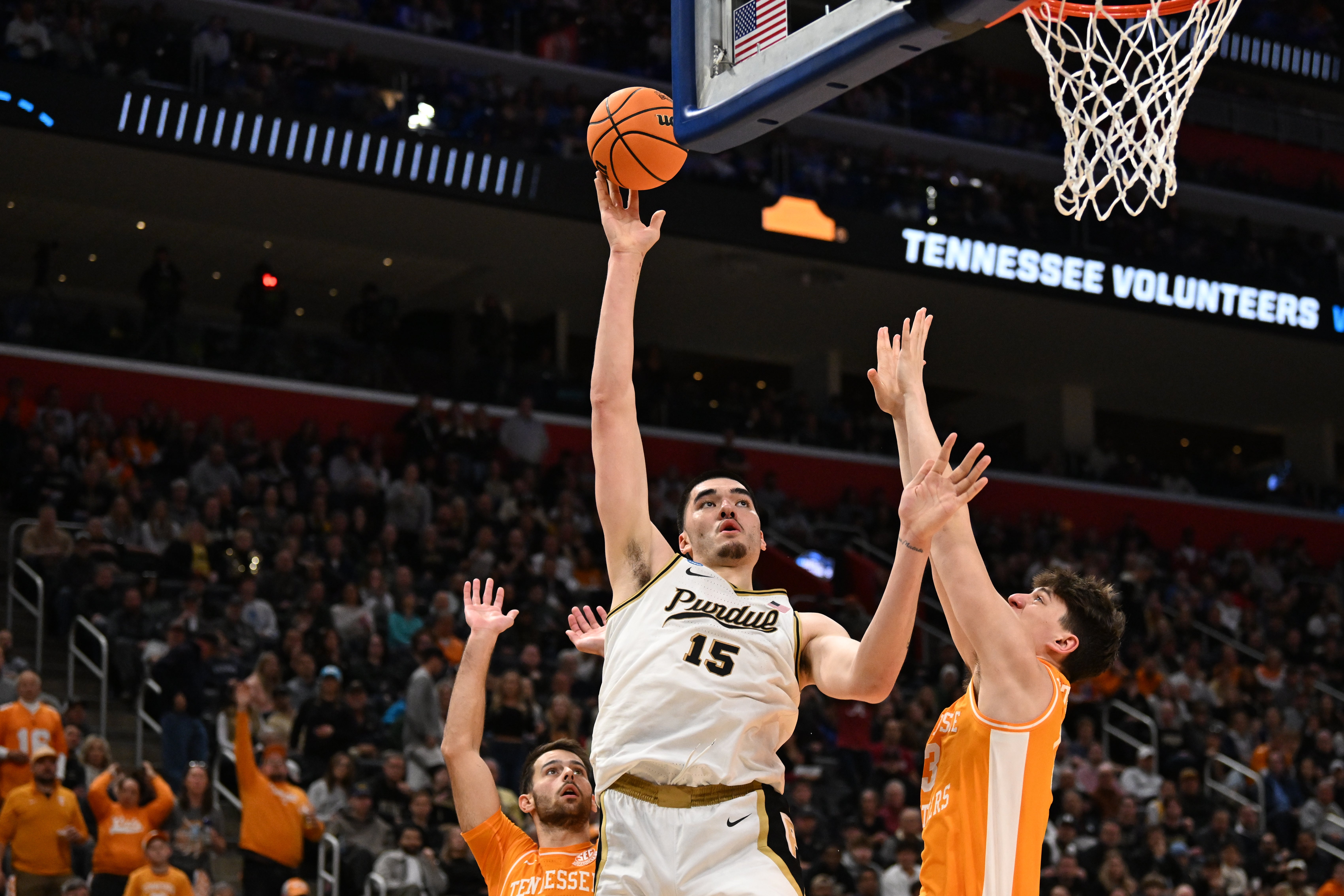 Mar 31, 2024; Detroit, MI, USA; Purdue Boilermakers center Zach Edey (15) shoots the ball defended by Tennessee Volunteers forward J.P. Estrella (13) in the first half during the NCAA Tournament Midwest Regional Championship at Little Caesars Arena.