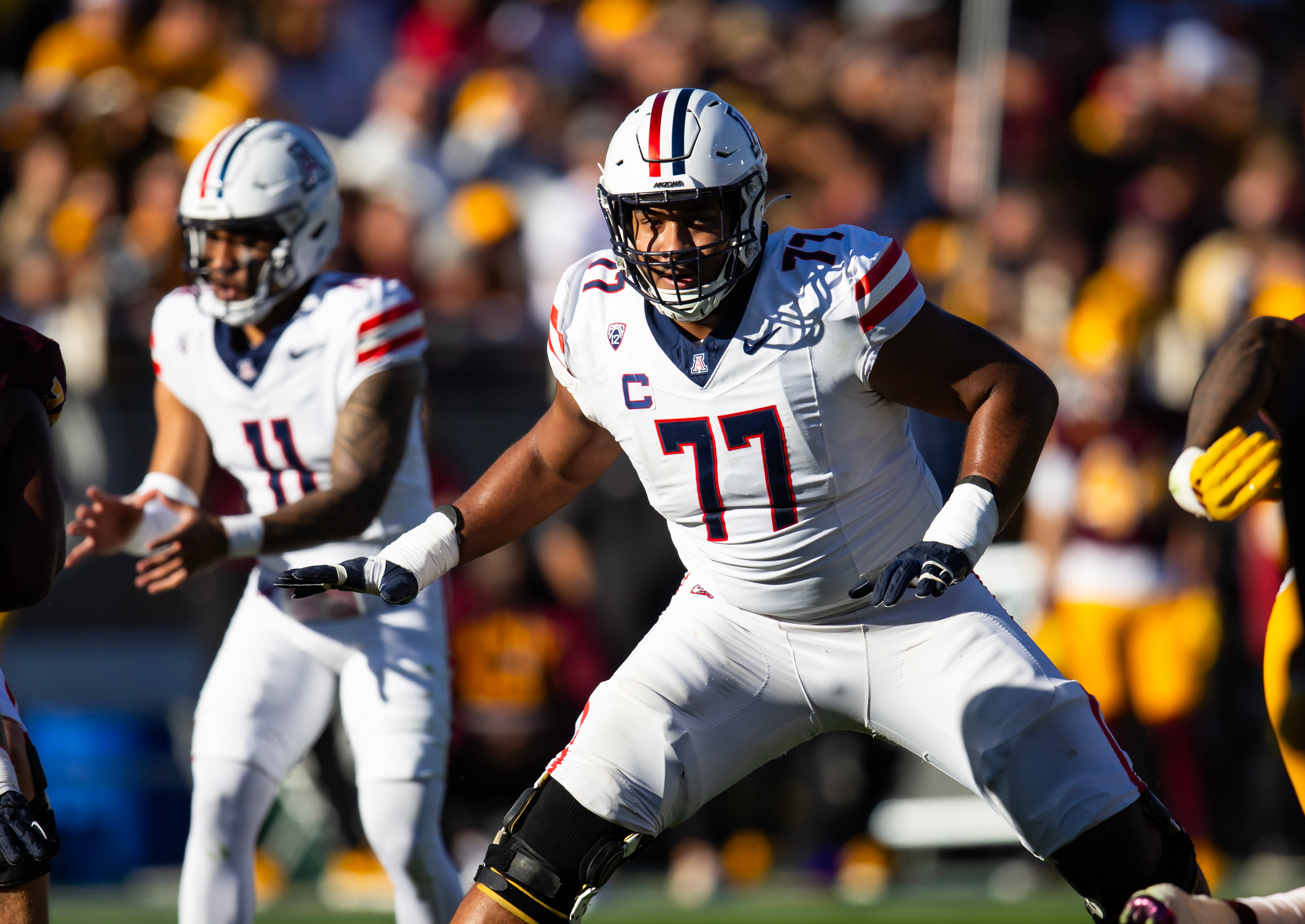 Nov 25, 2023; Tempe, Arizona, USA; Arizona Wildcats offensive lineman Jordan Morgan (77) against the Arizona State Sun Devils during the Territorial Cup at Mountain America Stadium.
