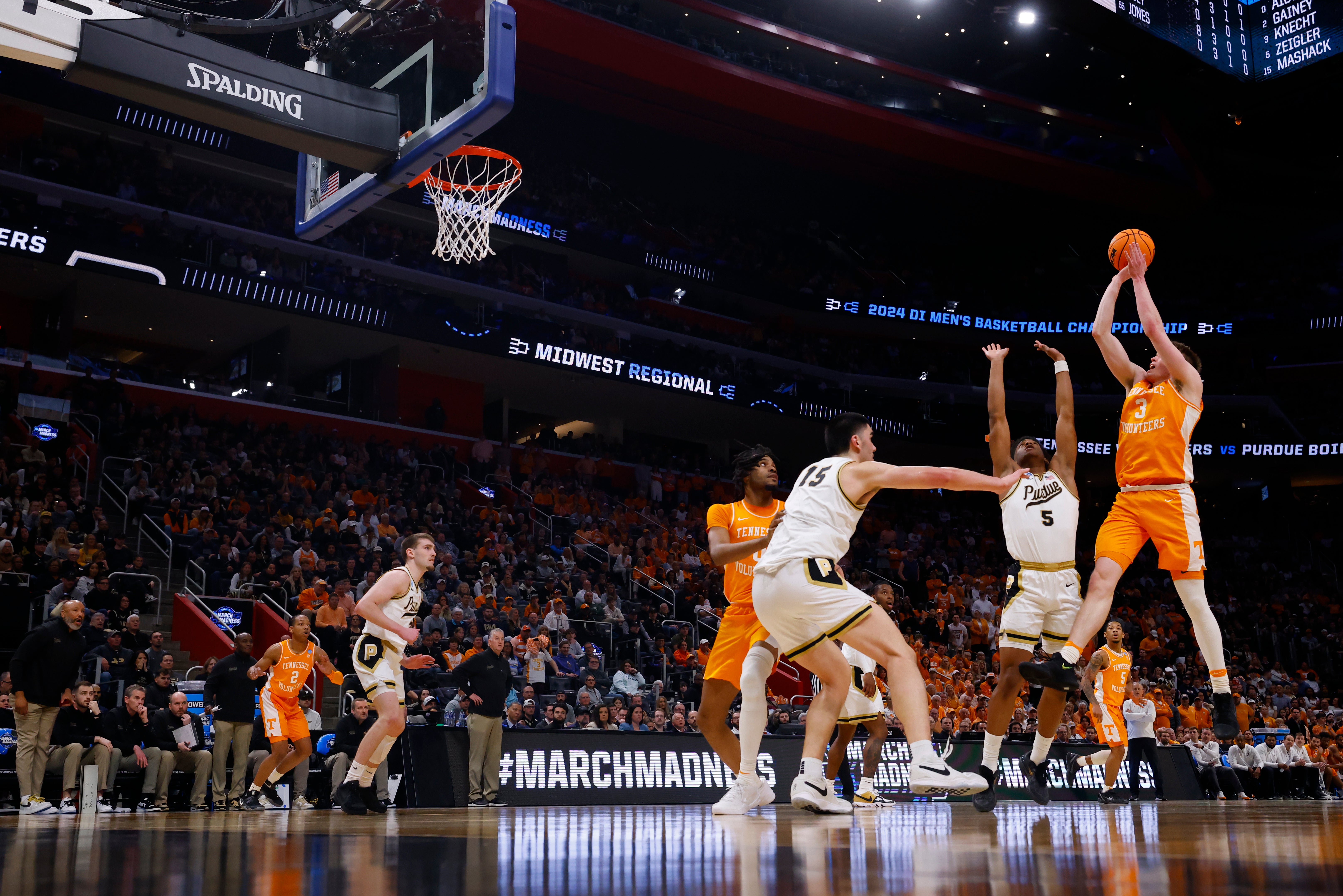 Mar 31, 2024; Detroit, MI, USA; Tennessee Volunteers guard Dalton Knecht (3) shoots the ball over Purdue Boilermakers guard Myles Colvin (5) in the first half during the NCAA Tournament Midwest Regional Championship at Little Caesars Arena.