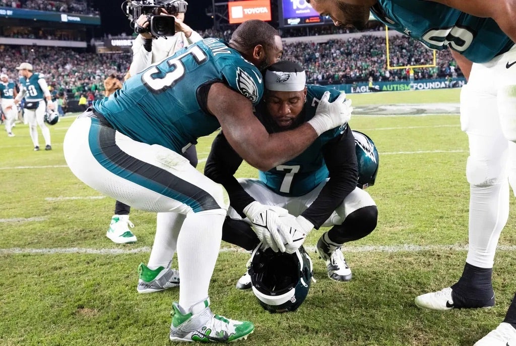 Philadelphia Eagles linebacker Haason Reddick (7) is hugged by defensive end Brandon Graham (55) after a victory against the Dallas Cowboys at Lincoln Financial Field.