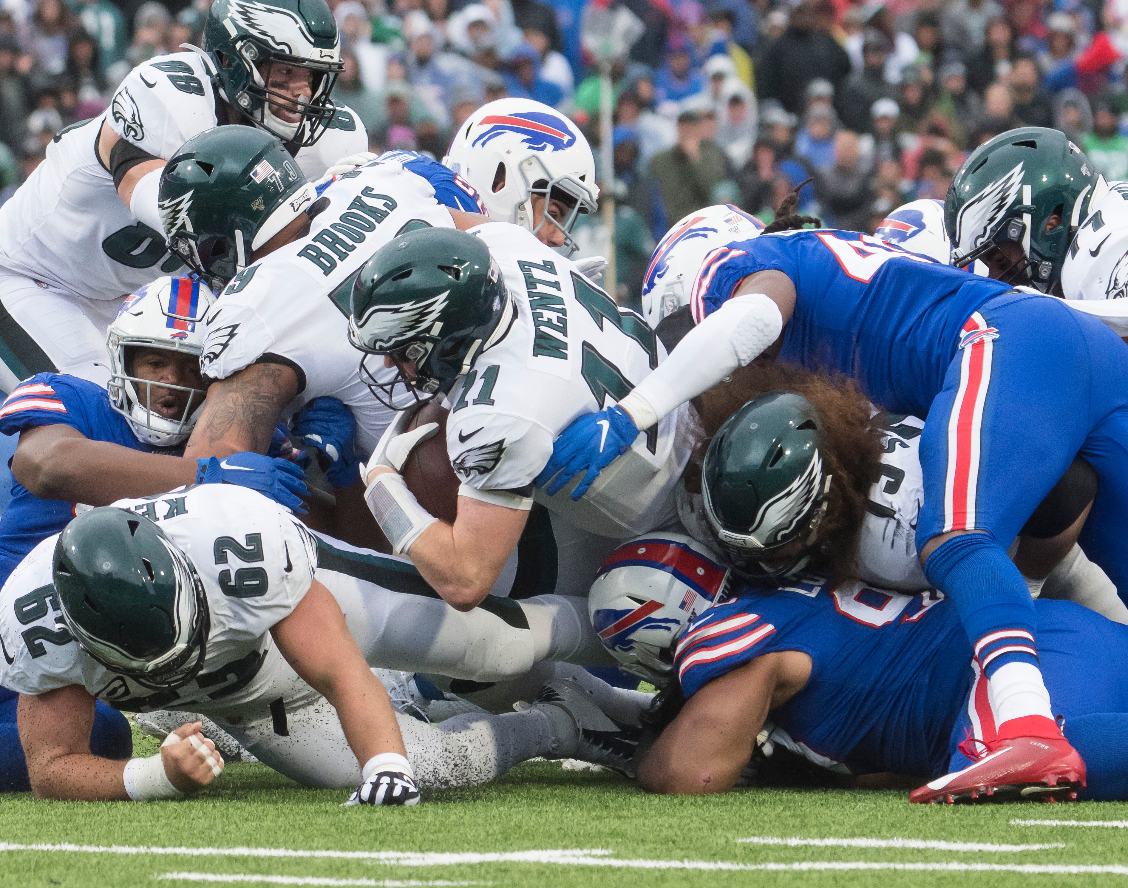 Oct 27, 2019; Orchard Park, NY, USA; Philadelphia Eagles quarterback Carson Wentz (11) sneaks through the line to pick up a first down against the Buffalo Bills in the second quarter at New Era Field.