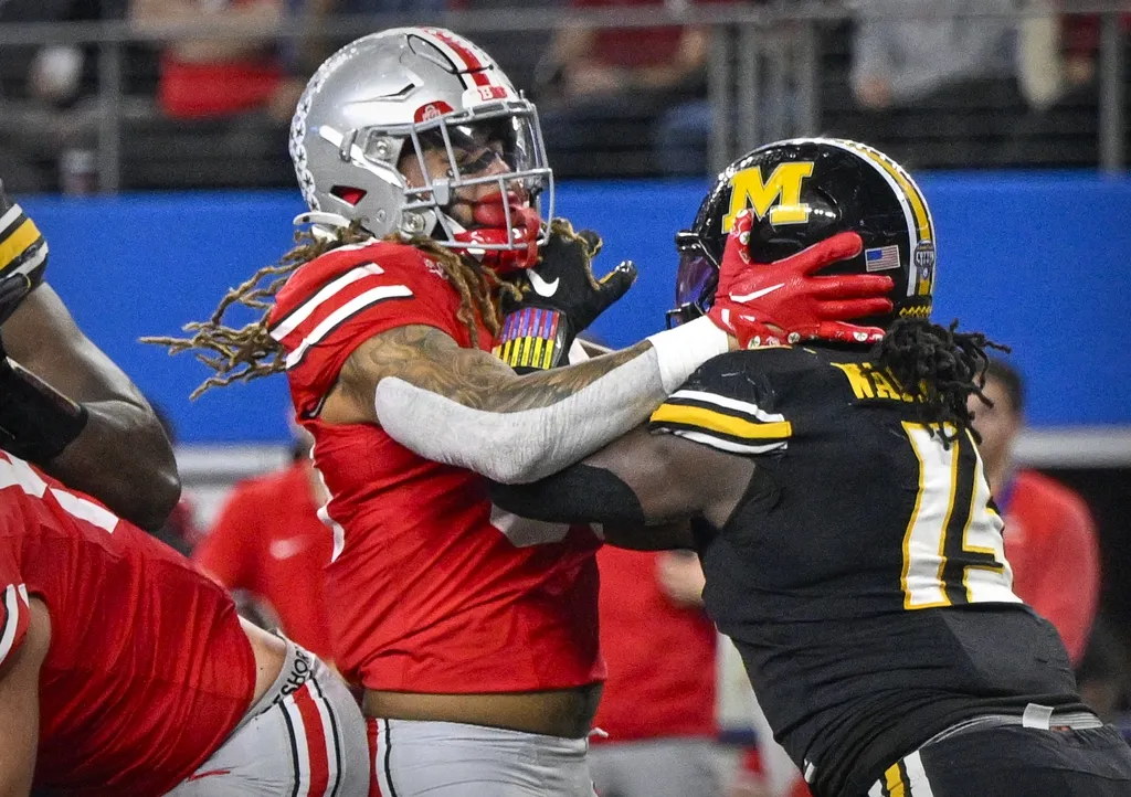 Missouri Tigers defensive lineman Johnny Walker Jr. (15) is called for a penalty after he slaps Ohio State Buckeyes tight end Gee Scott Jr. (88) during the second quarter at AT&T Stadium.