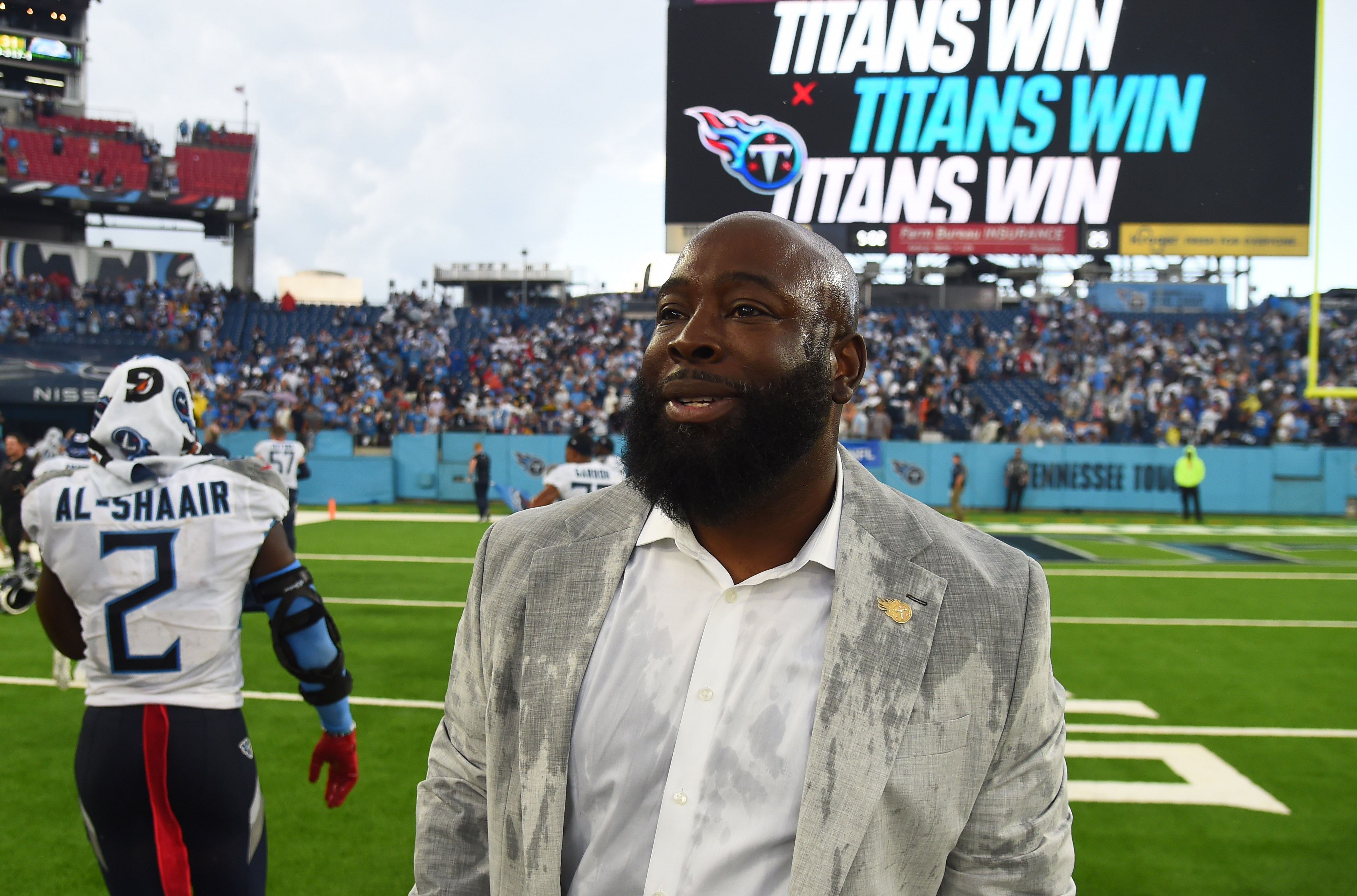 Sep 17, 2023; Nashville, Tennessee, USA; Tennessee Titans general manager Ran Carthon celebrates with players after a win against the Los Angeles Chargers at Nissan Stadium.