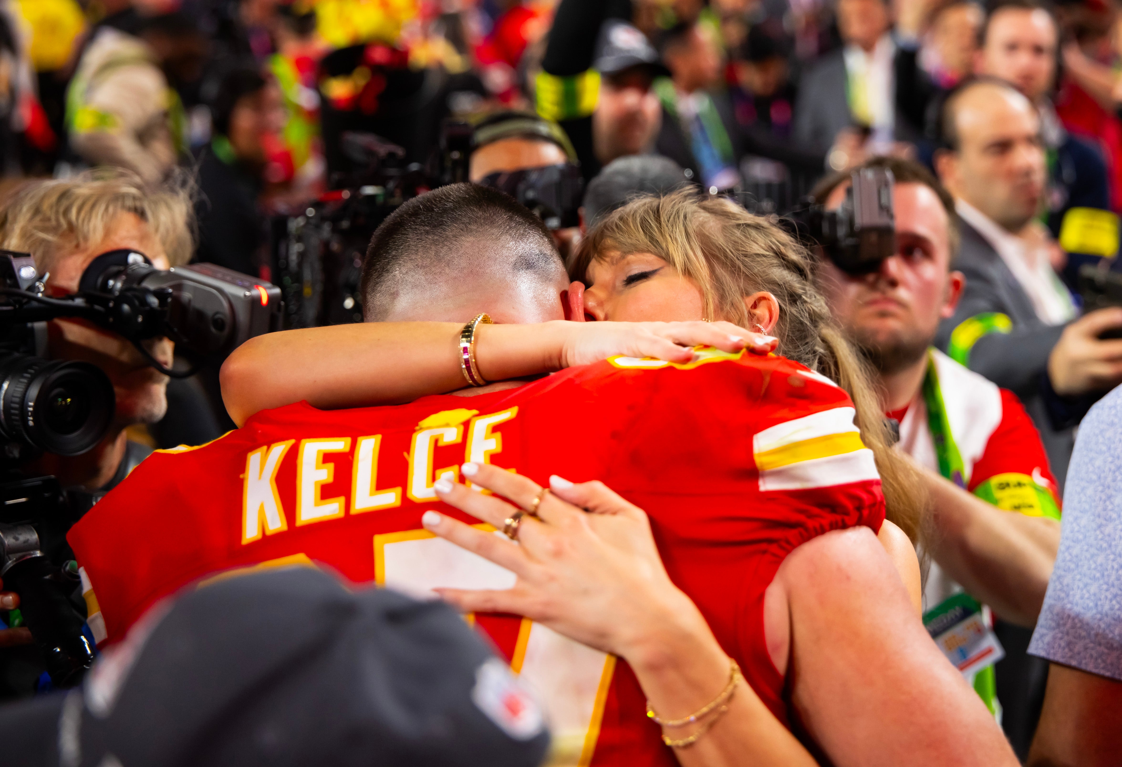 Feb 11, 2024; Paradise, Nevada, USA; Kansas City Chiefs tight end Travis Kelce (87) celebrates with girlfriend Taylor Swift after defeating the San Francisco 49ers in Super Bowl LVIII at Allegiant Stadium.