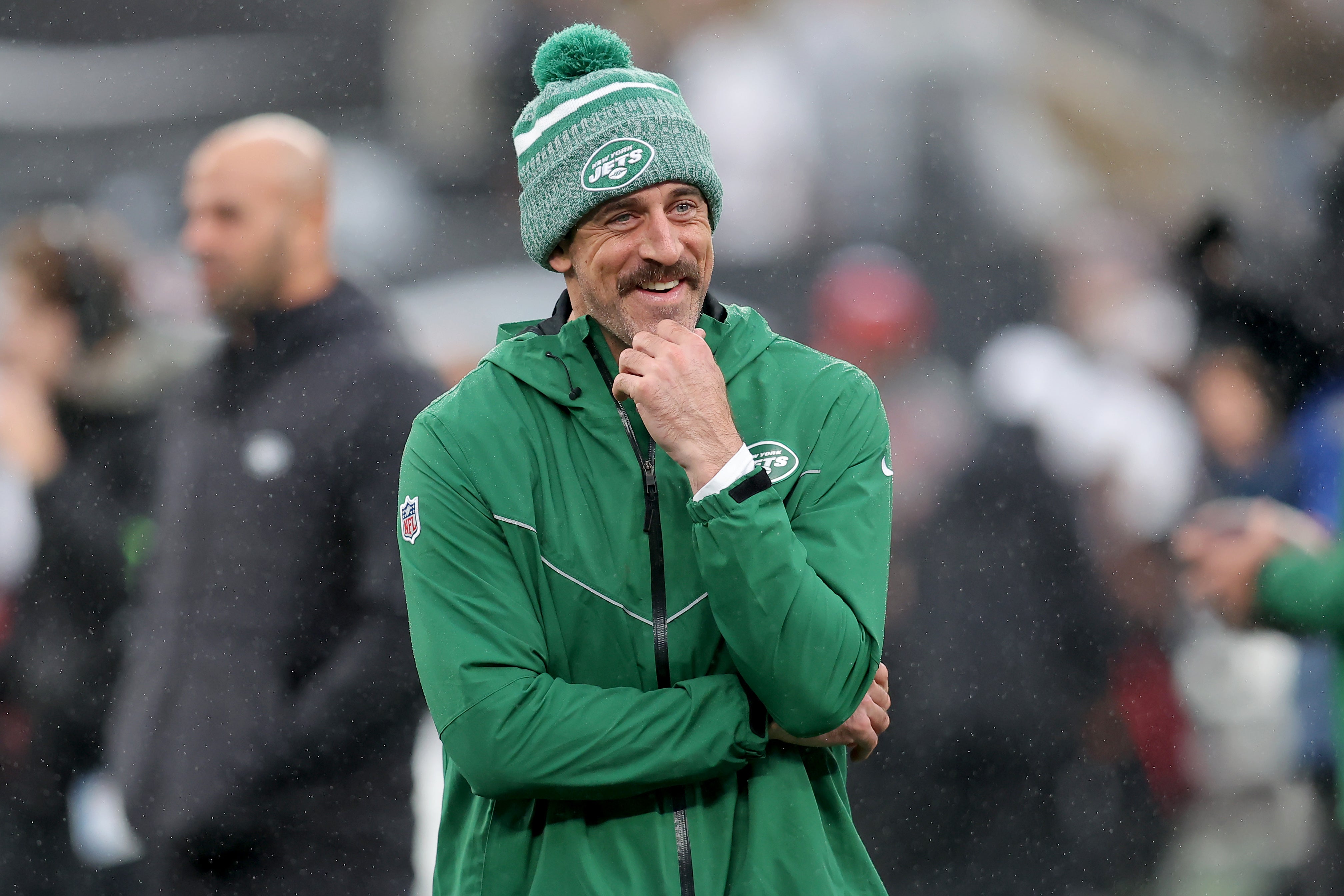 New York Jets quarterback Aaron Rodgers (8) watches warm ups before a game against the Atlanta Falcons at MetLife Stadium.