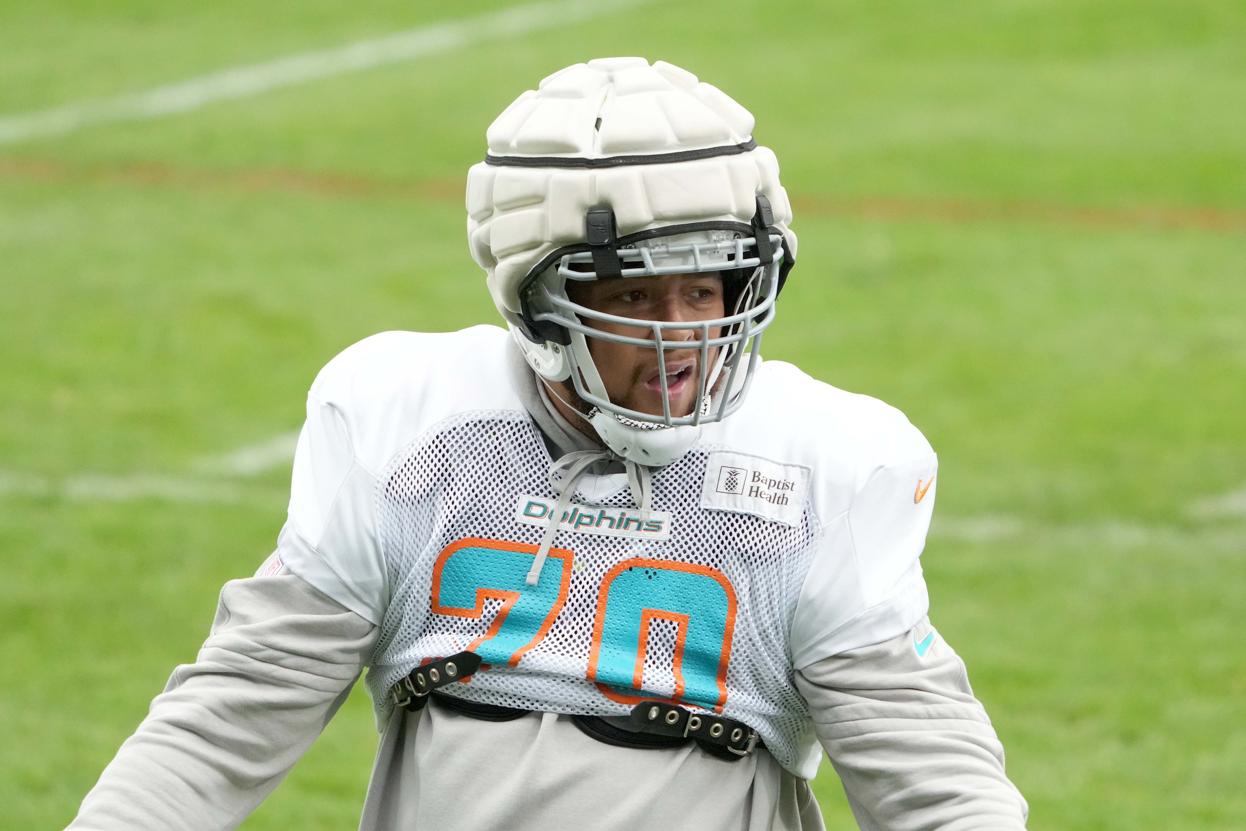Nov 2, 2023; Frankfurt, Germany; Miami Dolphins offensive tackle Kendall Lamm (70) wears a Guardian helmet cap during practice at the PSD Bank Arena.