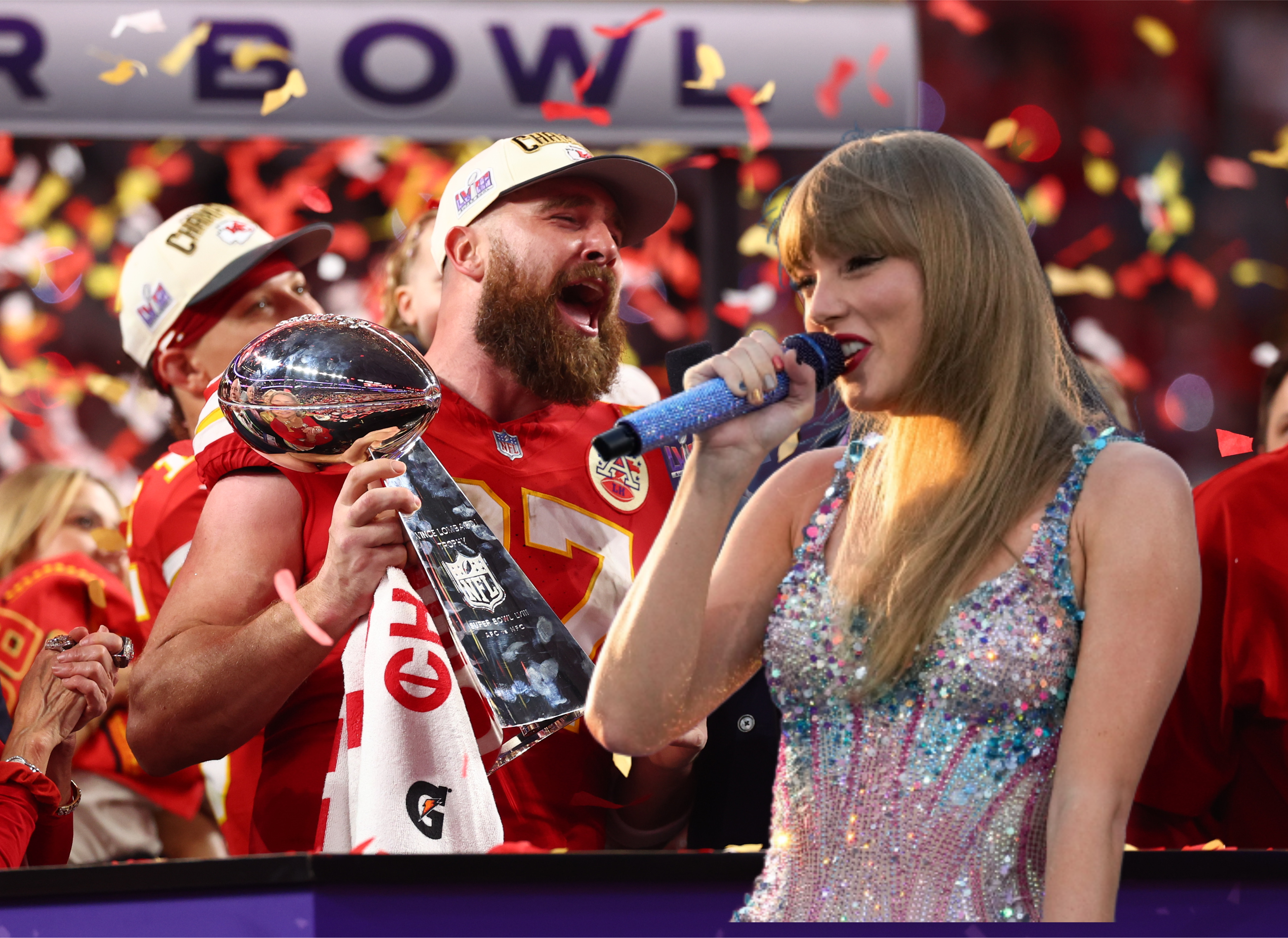 Travis Kelce and Taylor Swift with a microphone