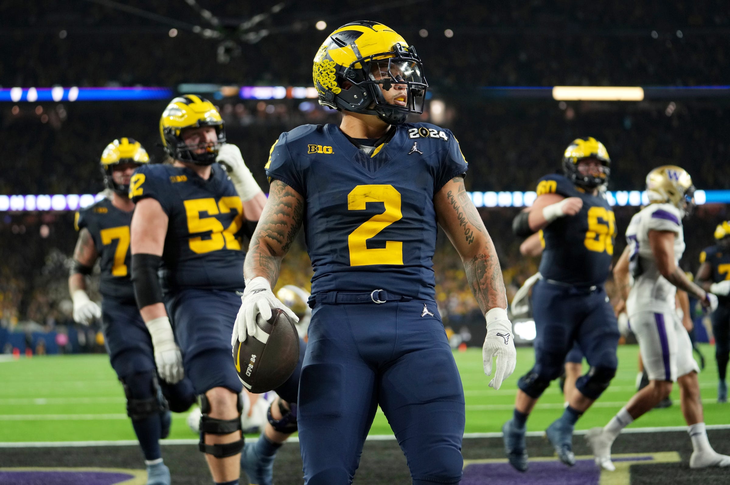 Michigan running back Blake Corum runs the ball in for a touchdown during fourth quarter at the College Football Playoff national championship game against Washington at NRG Stadium in Houston, Texas on Monday, Jan.8, 2024.