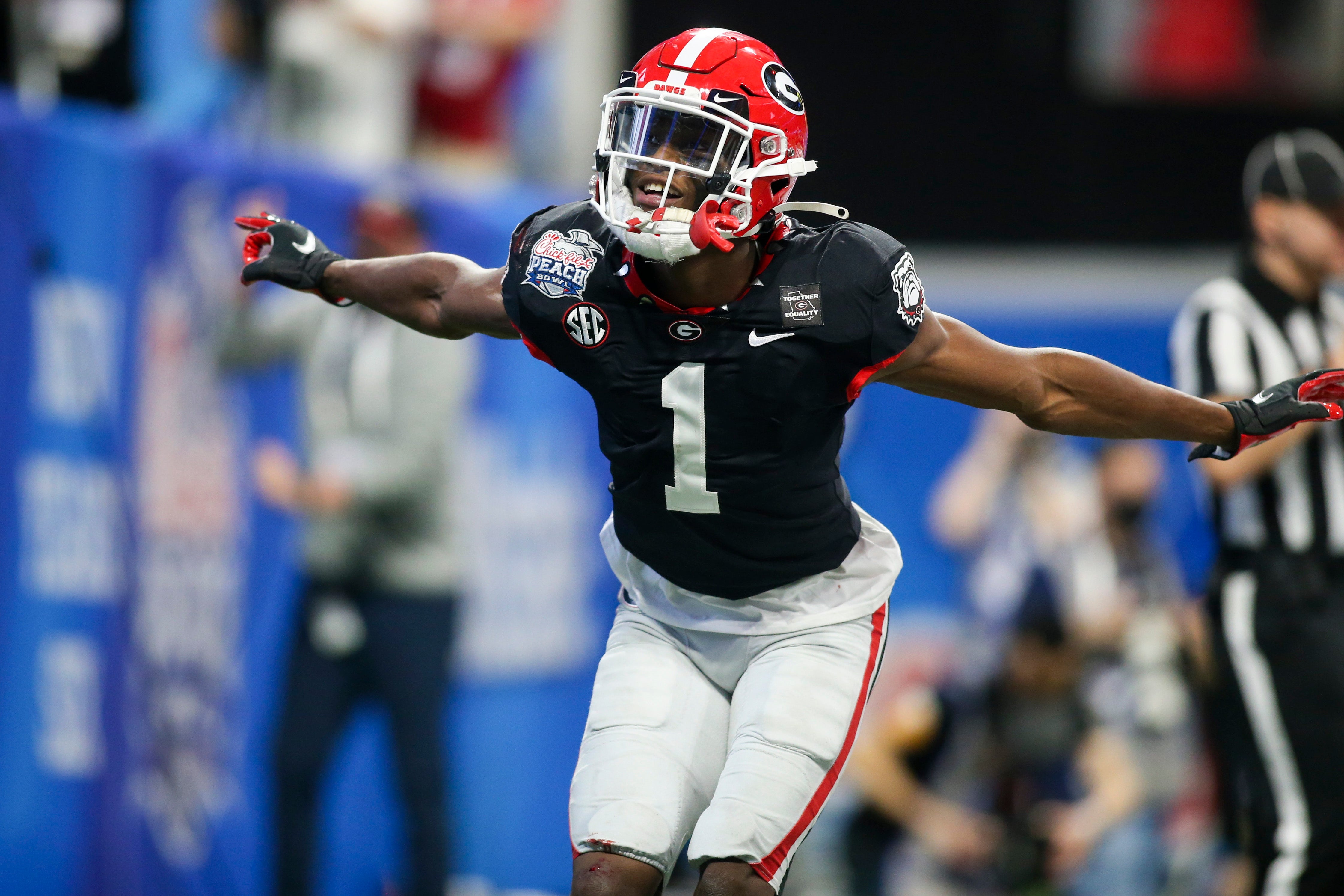 Jan 1, 2021; Atlanta, GA, USA; Georgia Bulldogs wide receiver George Pickens (1) celebrates after a touchdown catch against the Cincinnati Bearcats in the first quarter of the Chick-fil-A Peach Bowl at Mercedes-Benz Stadium.