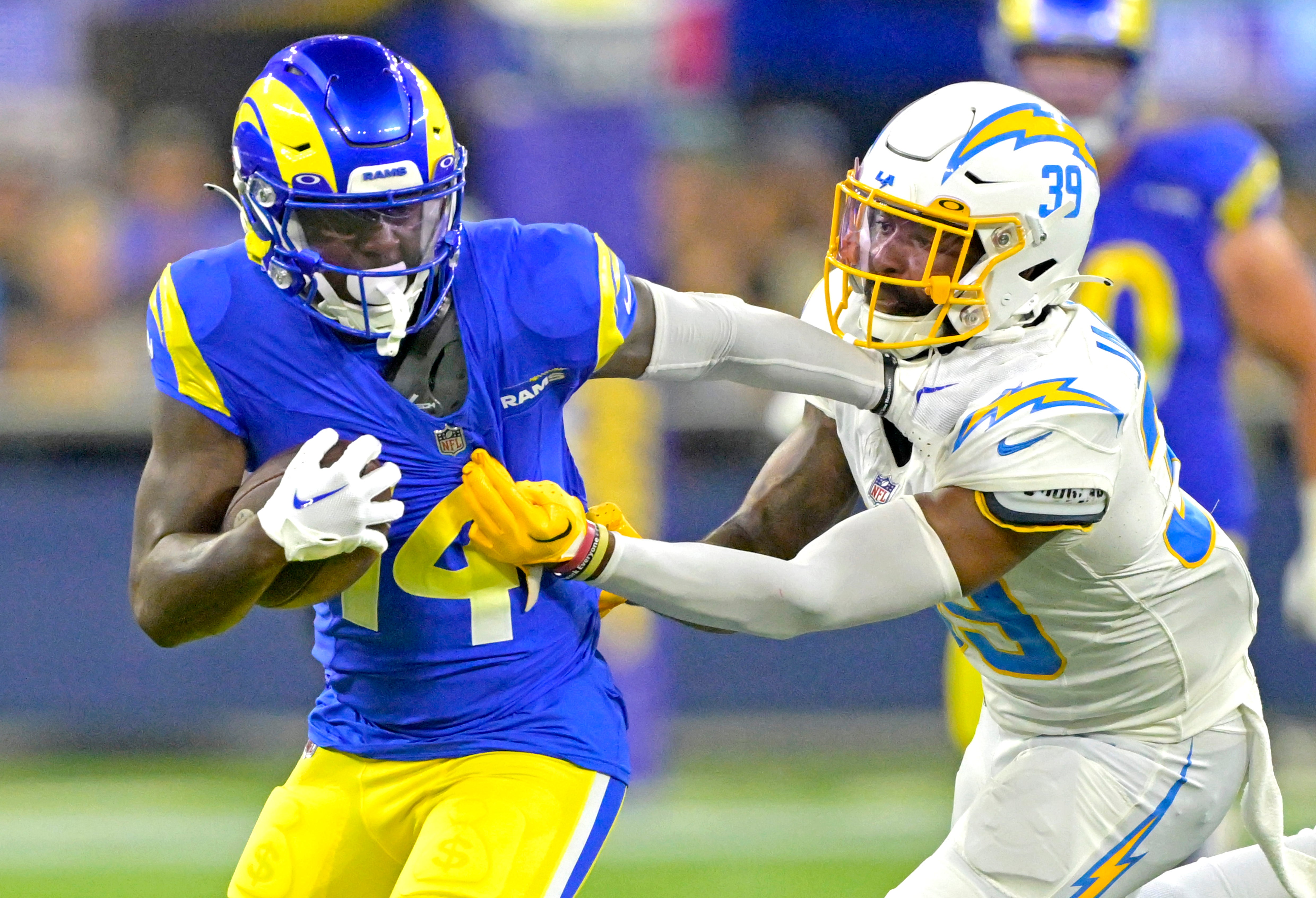 Aug 12, 2023; Inglewood, California, USA; Los Angeles Rams wide receiver Tyler Johnson (14) is stopped by Los Angeles Chargers cornerback Michael Jacquet (39) after a first down in the second half at SoFi Stadium. Mandatory Credit: Jayne Kamin-Oncea-USA TODAY Sports