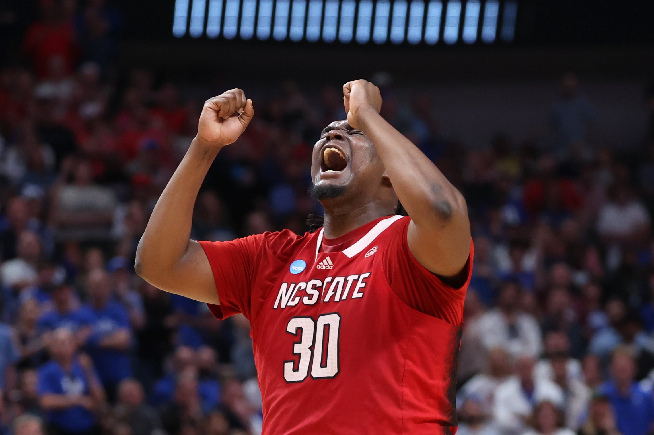 Mar 31, 2024; Dallas, TX, USA; North Carolina State Wolfpack forward DJ Burns Jr. (30) reacts in the second half against the Duke Blue Devils in the finals of the South Regional of the 2024 NCAA Tournament at American Airline Center.