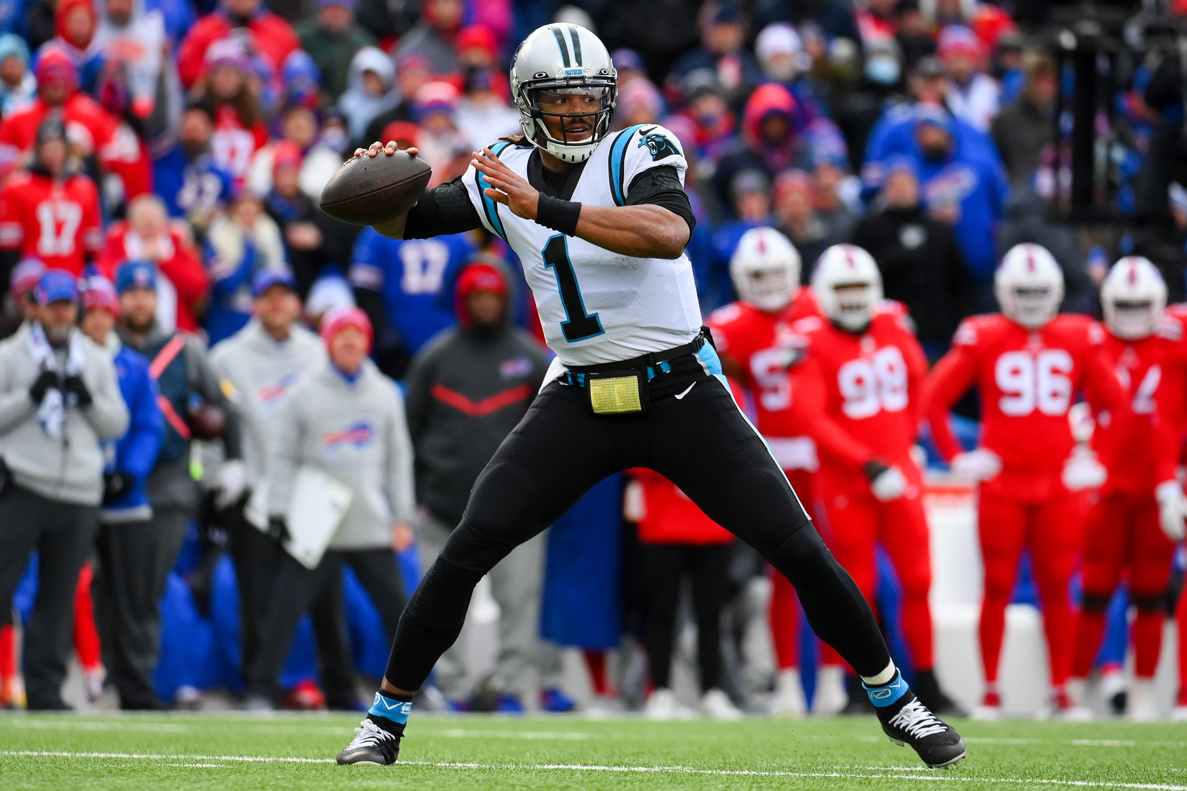 Dec 19, 2021; Orchard Park, New York, USA; Carolina Panthers quarterback Cam Newton (1) passes the ball against the Buffalo Bills during the first half at Highmark Stadium. Mandatory Credit: Rich Barnes-USA TODAY Sports
