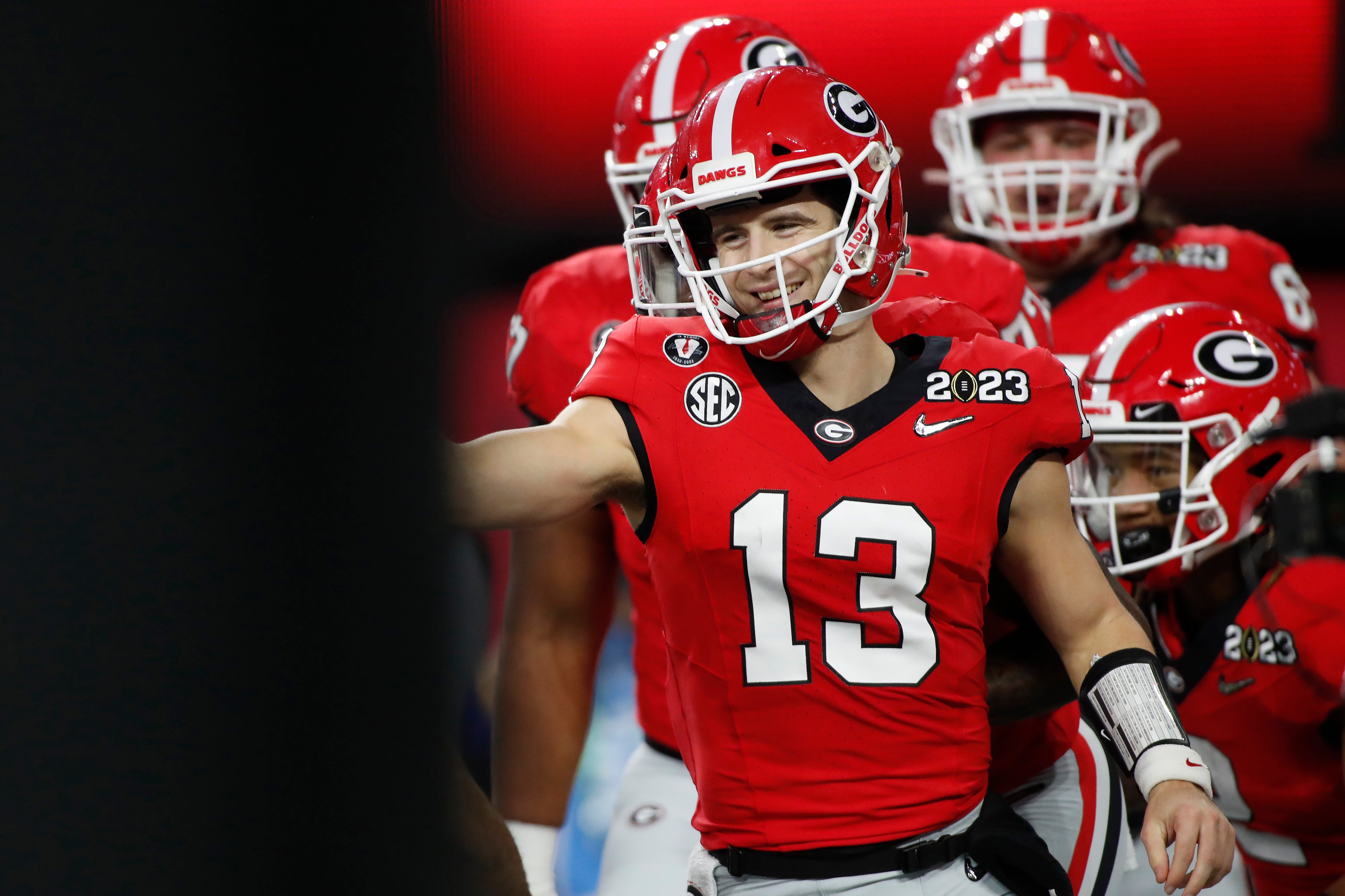 Georgia quarterback Stetson Bennett (13) celebrates after scoring a touchdown during the first half of the NCAA College Football National Championship game between TCU and Georgia on Monday, Jan. 9, 2023, in Inglewood, Calif.