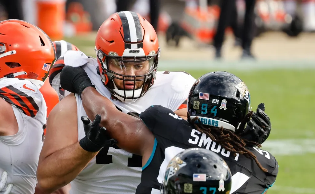 Cleveland Browns offensive tackle Jedrick Wills (71) blocks Jacksonville Jaguars defensive end Dawuane Smoot (94) during the second half at TIAA Bank Field.