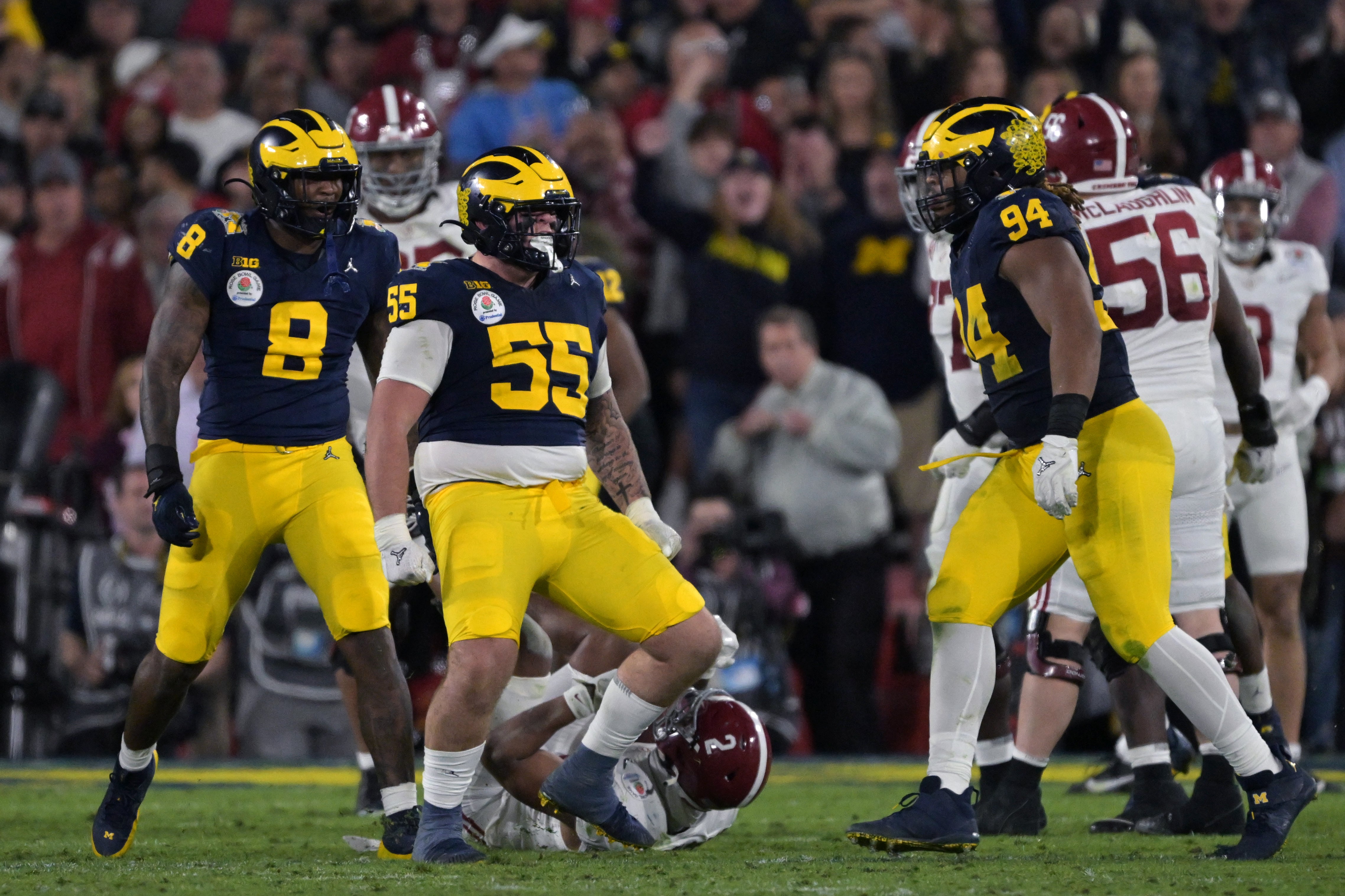 Jan 1, 2024; Pasadena, CA, USA; Michigan Wolverines defensive lineman Mason Graham (55) celebrates after a tackle against the Alabama Crimson Tide during overtime in the 2024 Rose Bowl college football playoff semifinal game at Rose Bowl.