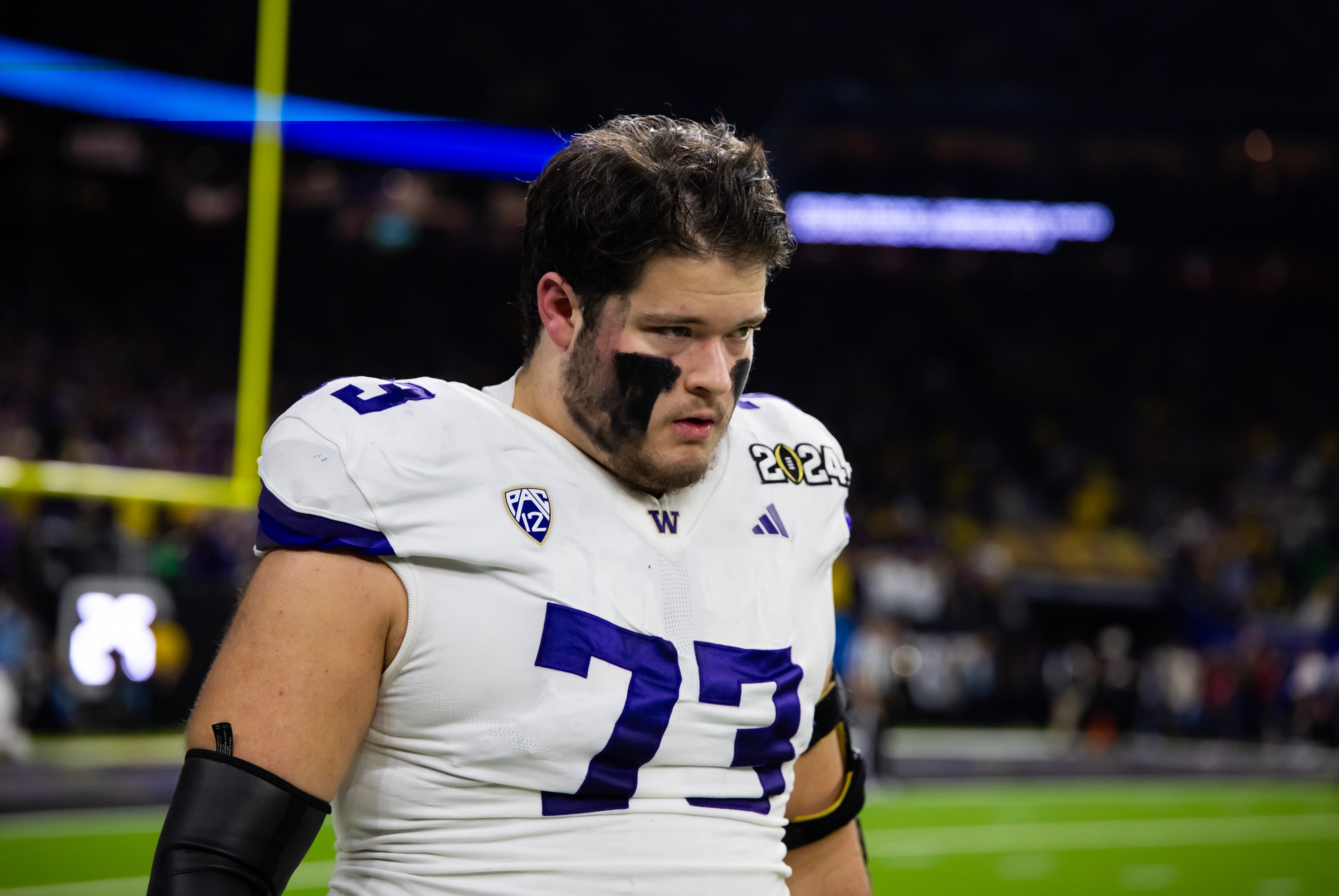 Jan 8, 2024; Houston, TX, USA; Washington Huskies offensive lineman Roger Rosengarten (73) against the Michigan Wolverines during the 2024 College Football Playoff national championship game at NRG Stadium.