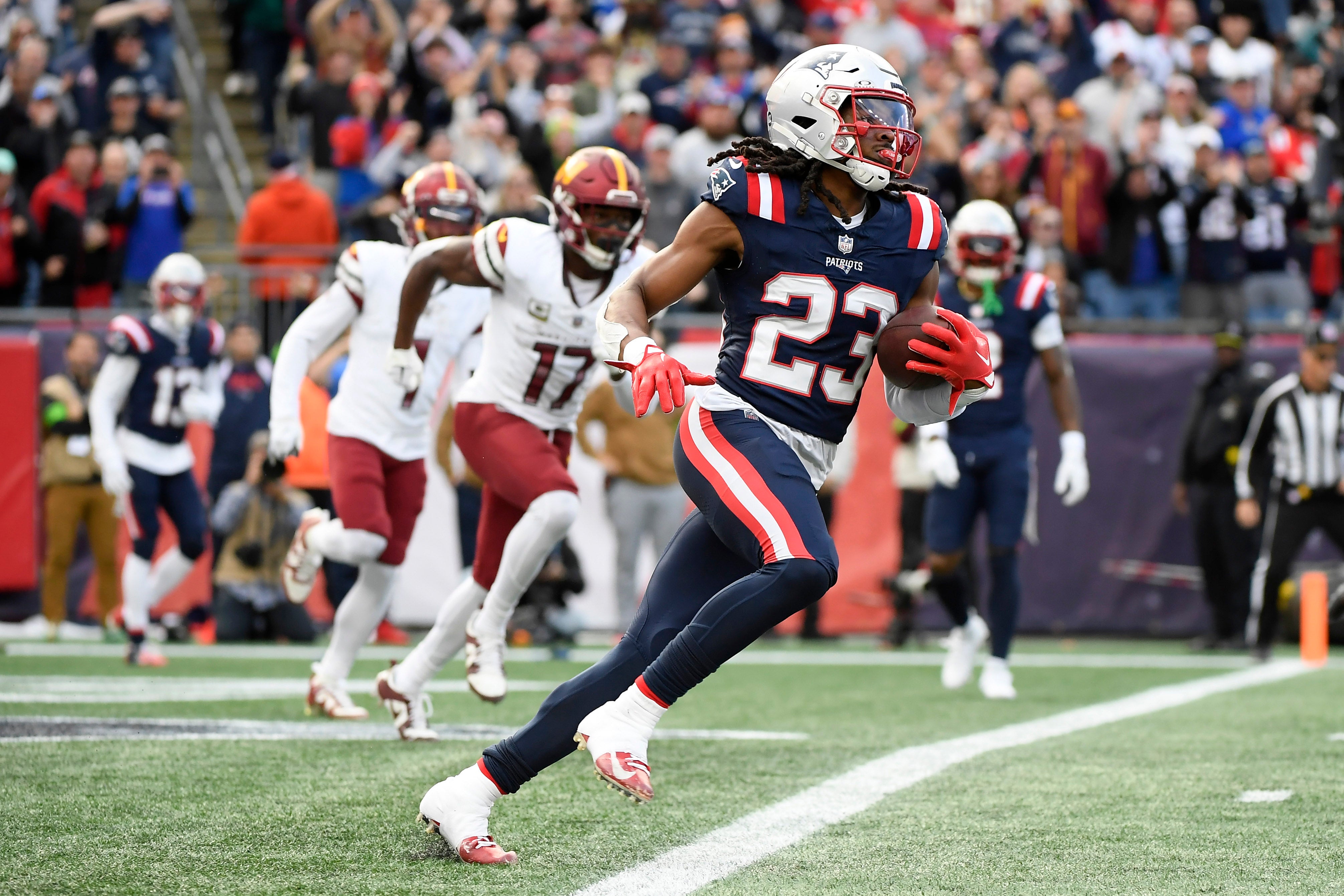 Nov 5, 2023; Foxborough, Massachusetts, USA; New England Patriots safety Kyle Dugger (23) runs the ball out of the end zone after an interception during the first half against the Washington Commanders at Gillette Stadium.