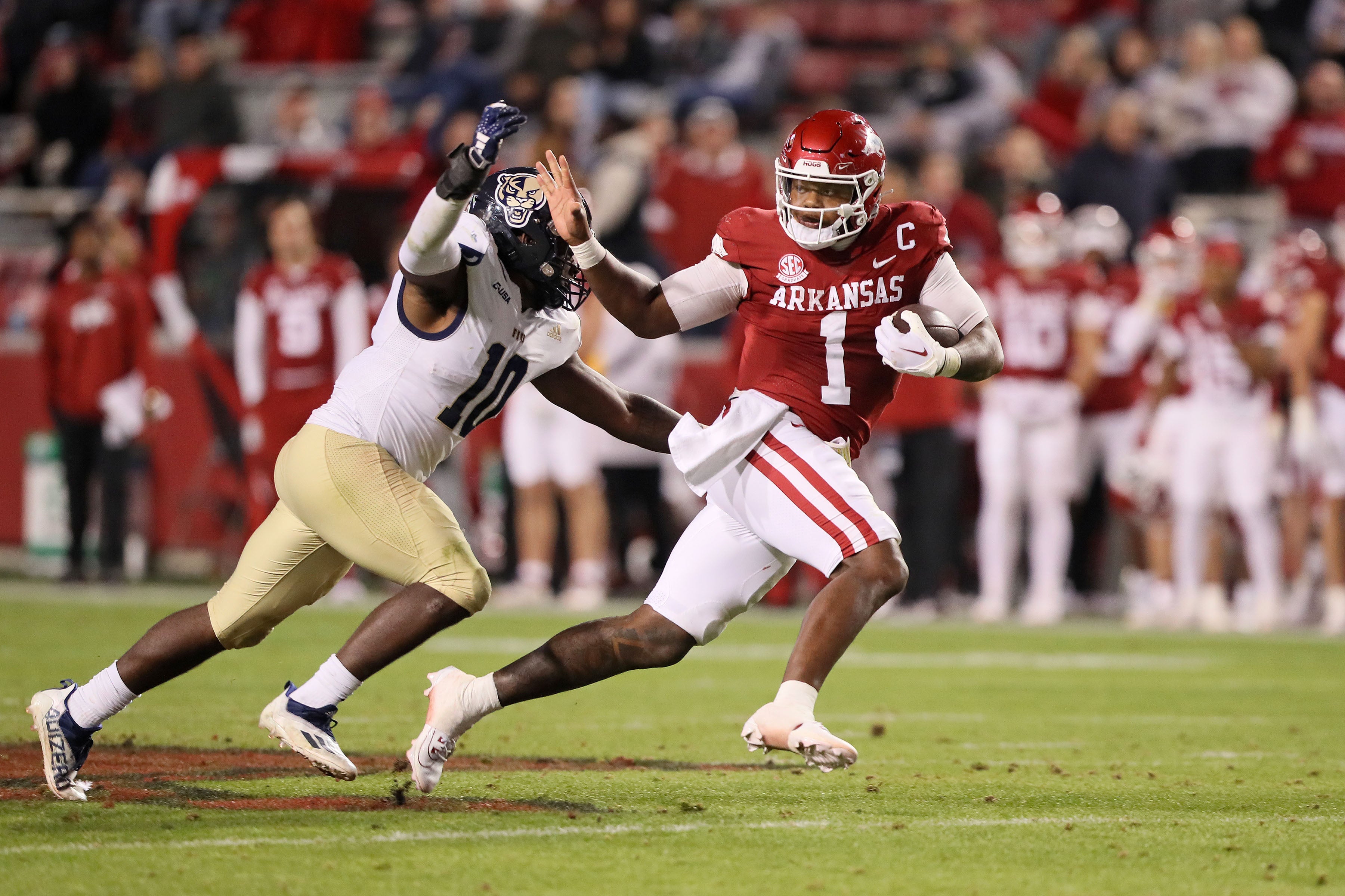 Nov 18, 2023; Fayetteville, Arkansas, USA; Arkansas Razorbacks quarterback KJ Jefferson (1) rushes in the third quarter as FIU Panthers linebacker Donovan Manuel (10) attempts a tackle at Donald W. Reynolds Razorback Stadium. Arkansas won 44-20.