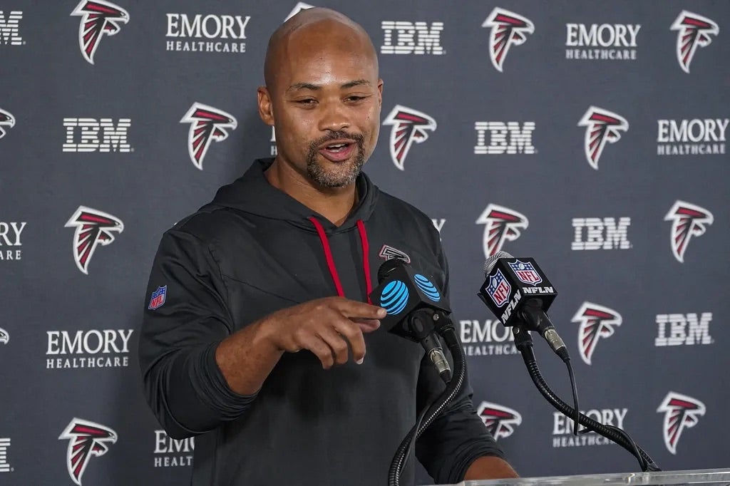 Atlanta Falcons general manager Terry Fontenot shown being interviewed by the media during training camp at IBM Performance Field.