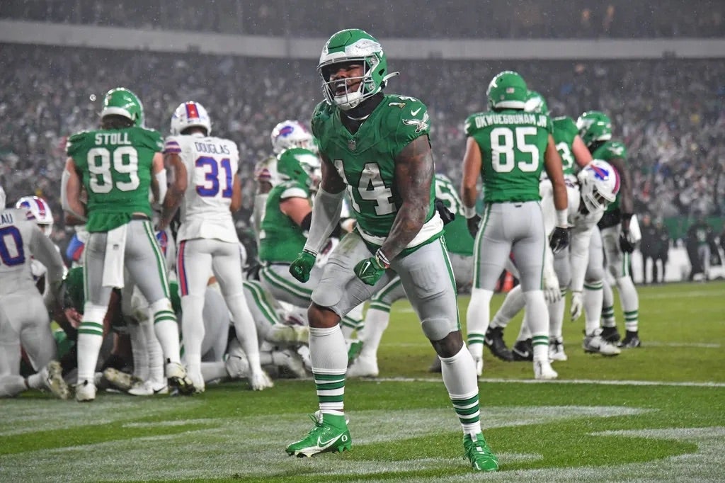 Philadelphia Eagles running back Kenneth Gainwell (14) celebrates touchdown run by quarterback Jalen Hurts (1) (not pictured) against the Buffalo Bills during the first quarter at Lincoln Financial Field.