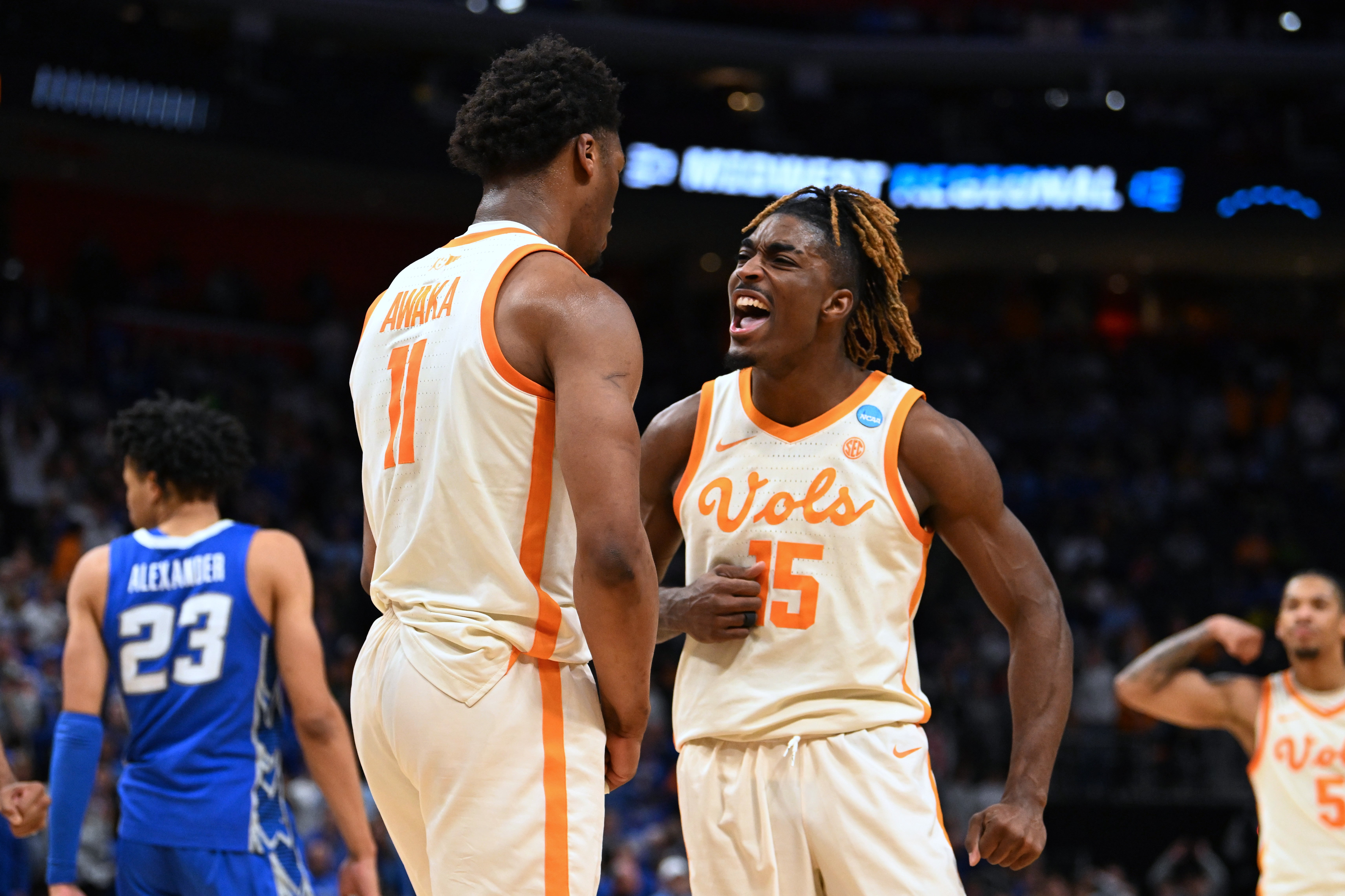 Mar 29, 2024; Detroit, MN, USA; Tennessee Volunteers forward Tobe Awaka (11) celebrates with guard Jahmai Mashack (15) in the second half against the Creighton Bluejays during the NCAA Tournament Midwest Regional at Little Caesars Arena.