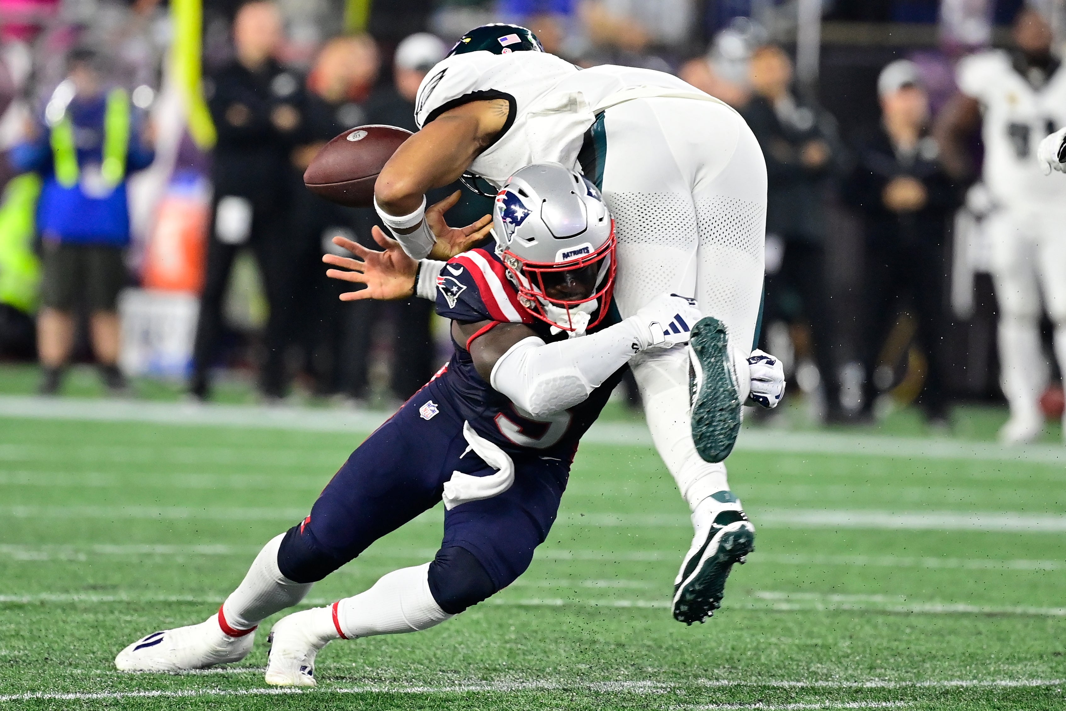 Sep 10, 2023; Foxborough, Massachusetts, USA; New England Patriots safety Jabrill Peppers (5) forces Philadelphia Eagles quarterback Jalen Hurts (1) to fumble the ball during the second half at Gillette Stadium.