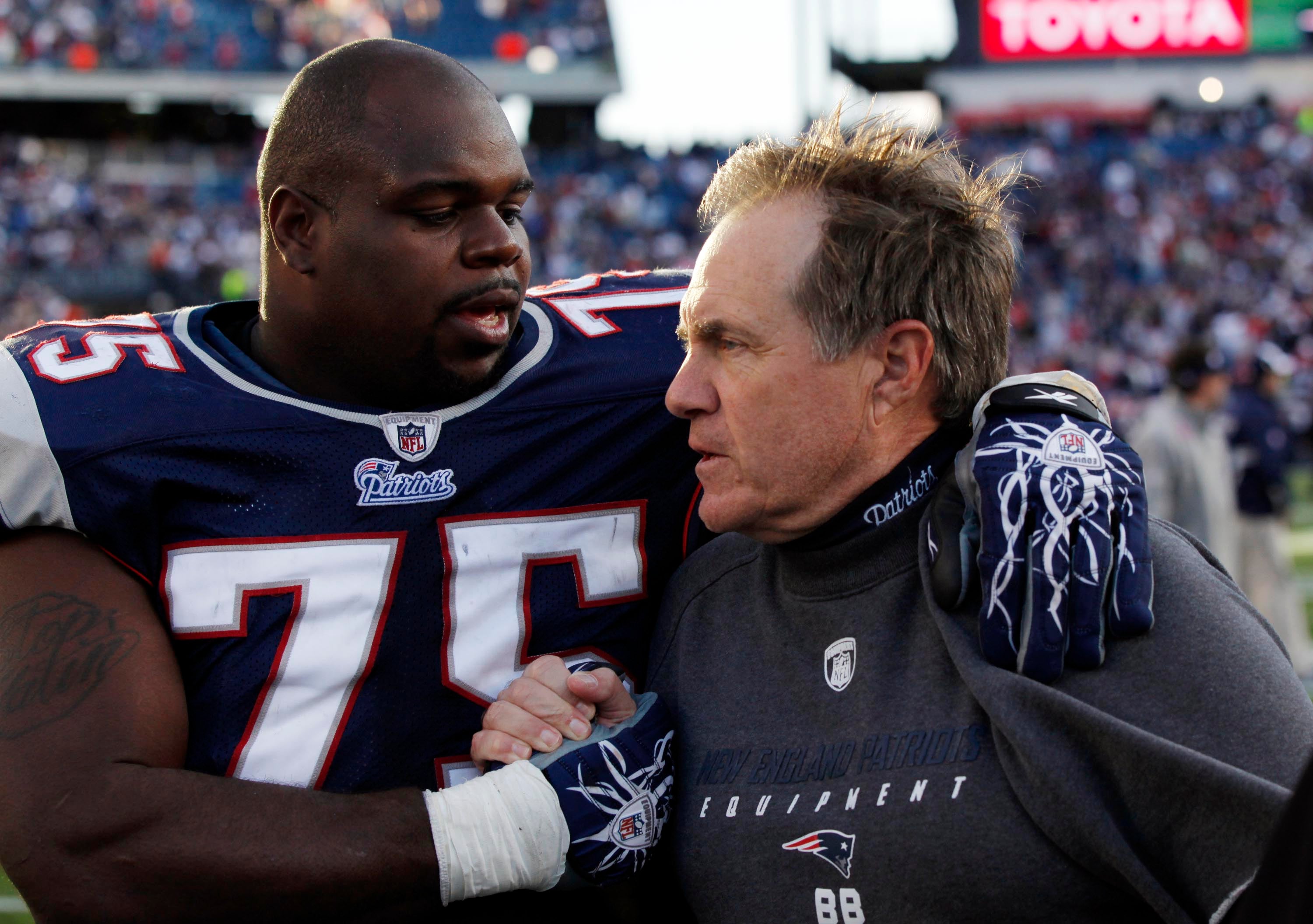 Oct 17, 2010; Foxboro, MA, USA; New England Patriots head coach Bill Belichick congratulates defensive tackle Vince Wilfork (75) after the game against the Baltimore Ravens at Gillette Stadium. The Patriots defeated the Ravens in overtime 23-20.
