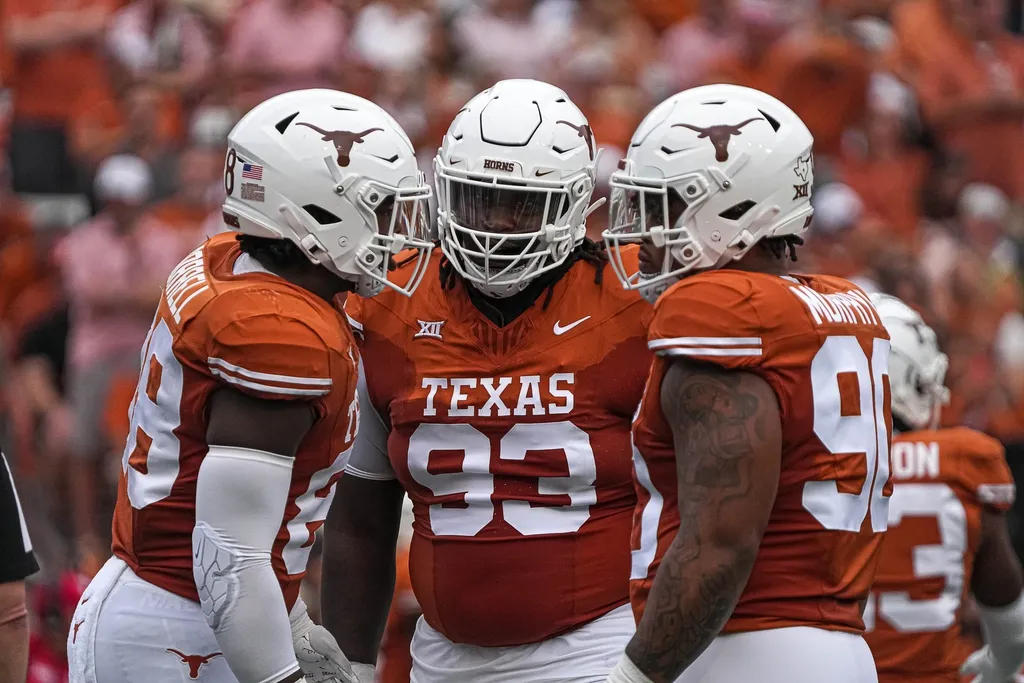 Texas defensive lineman T'Vondre Sweat (93), center, huddles with teammates during the game against Kansas State at Royal-Memorial Stadium on Saturday, Nov. 4, 2023 in Austin