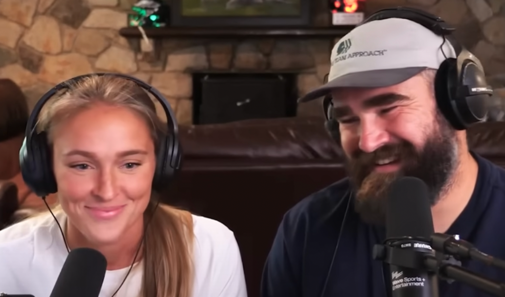 Kylie Kelce and Jason Kelce laugh together on the New Heights podcast.