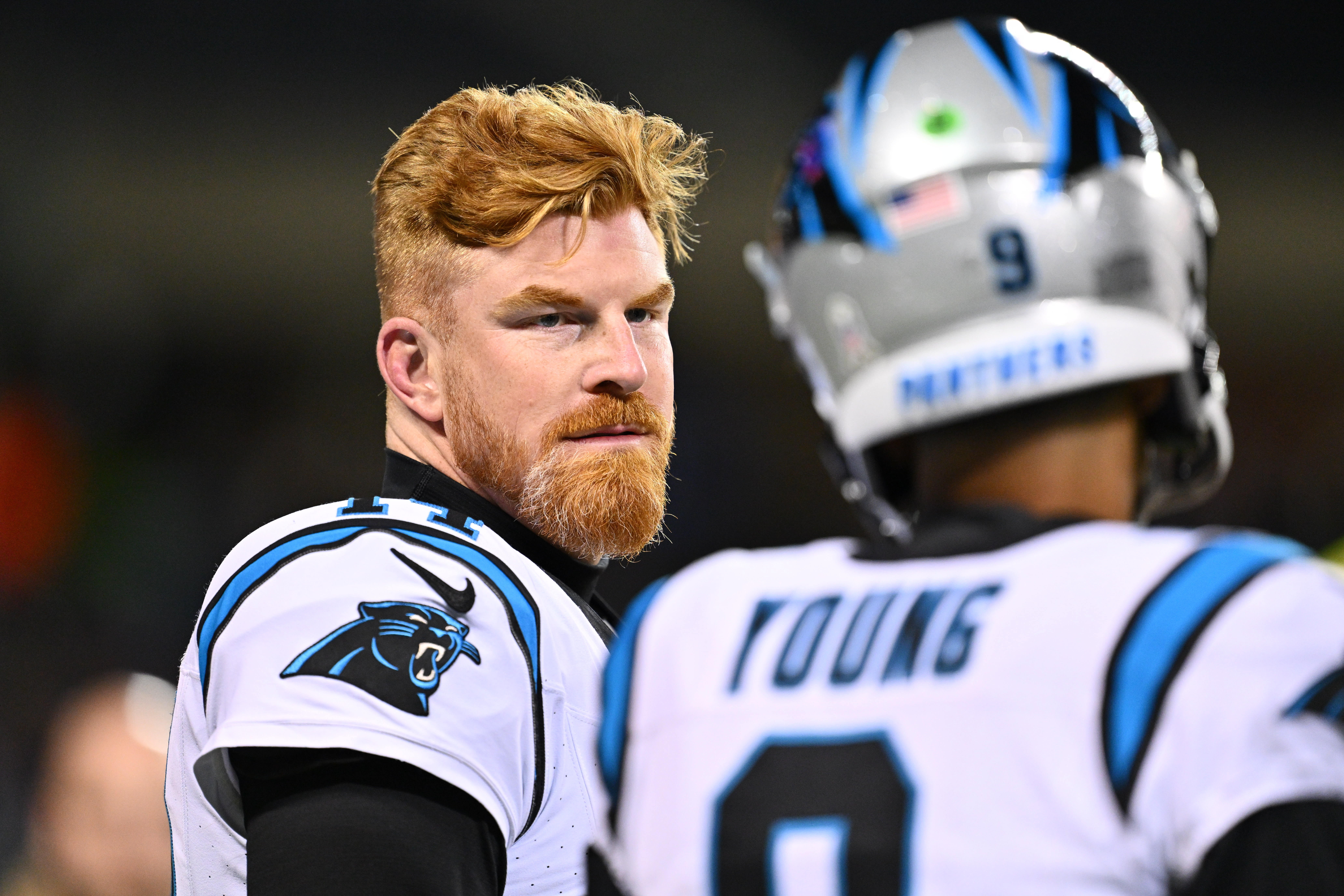Nov 9, 2023; Chicago, Illinois, USA; Carolina Panthers quarterback Andy Dalton (14) listens to quarterback Bryce Young (9) as they warm up before a game against the Chicago Bears at Soldier Field. Mandatory Credit: Jamie Sabau-USA TODAY Sports