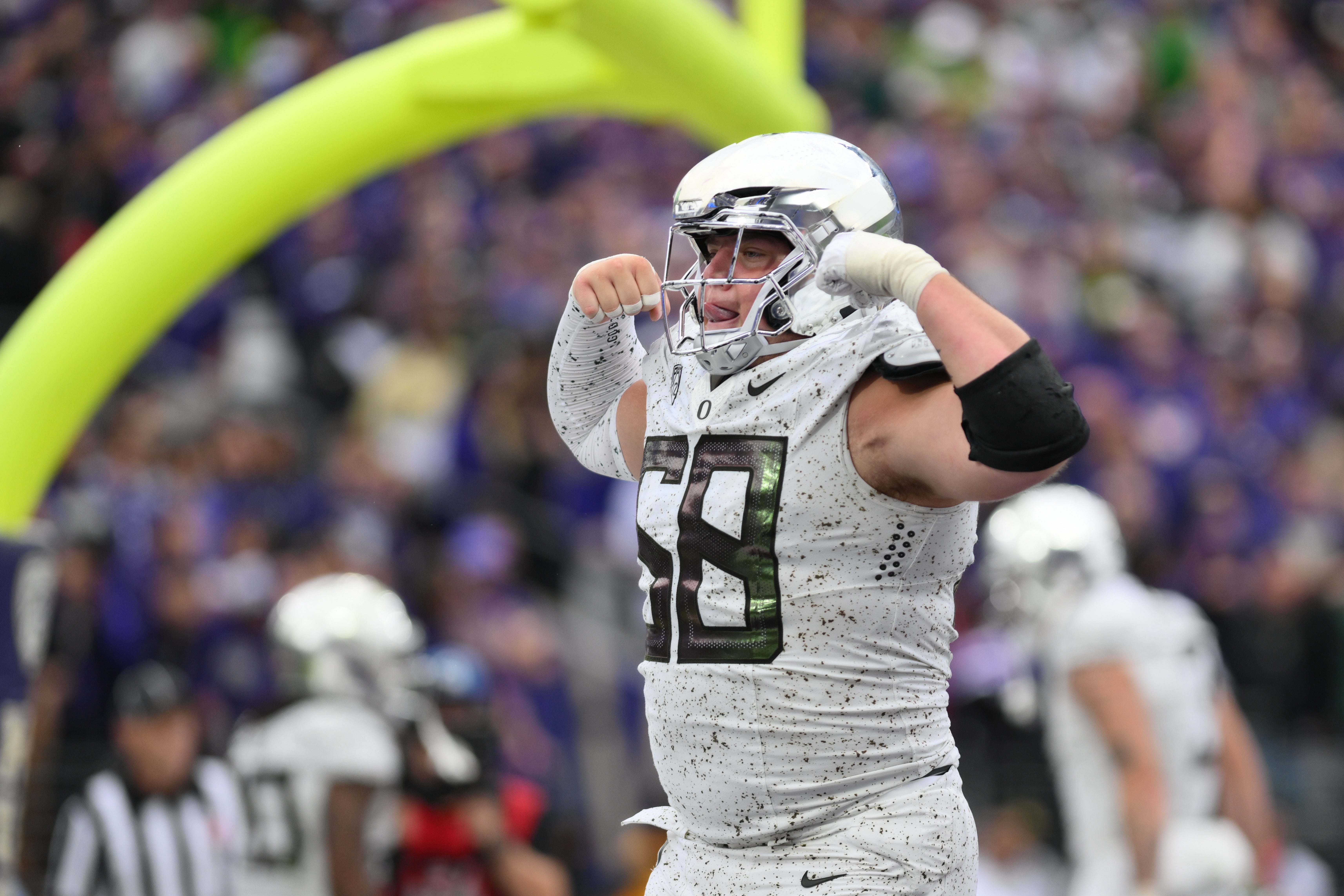 Oct 14, 2023; Seattle, Washington, USA; Oregon Ducks offensive lineman Jackson Powers-Johnson (58) celebrates after the Ducks scored a touchdown against the Washington Huskies during the second half at Alaska Airlines Field at Husky Stadium.