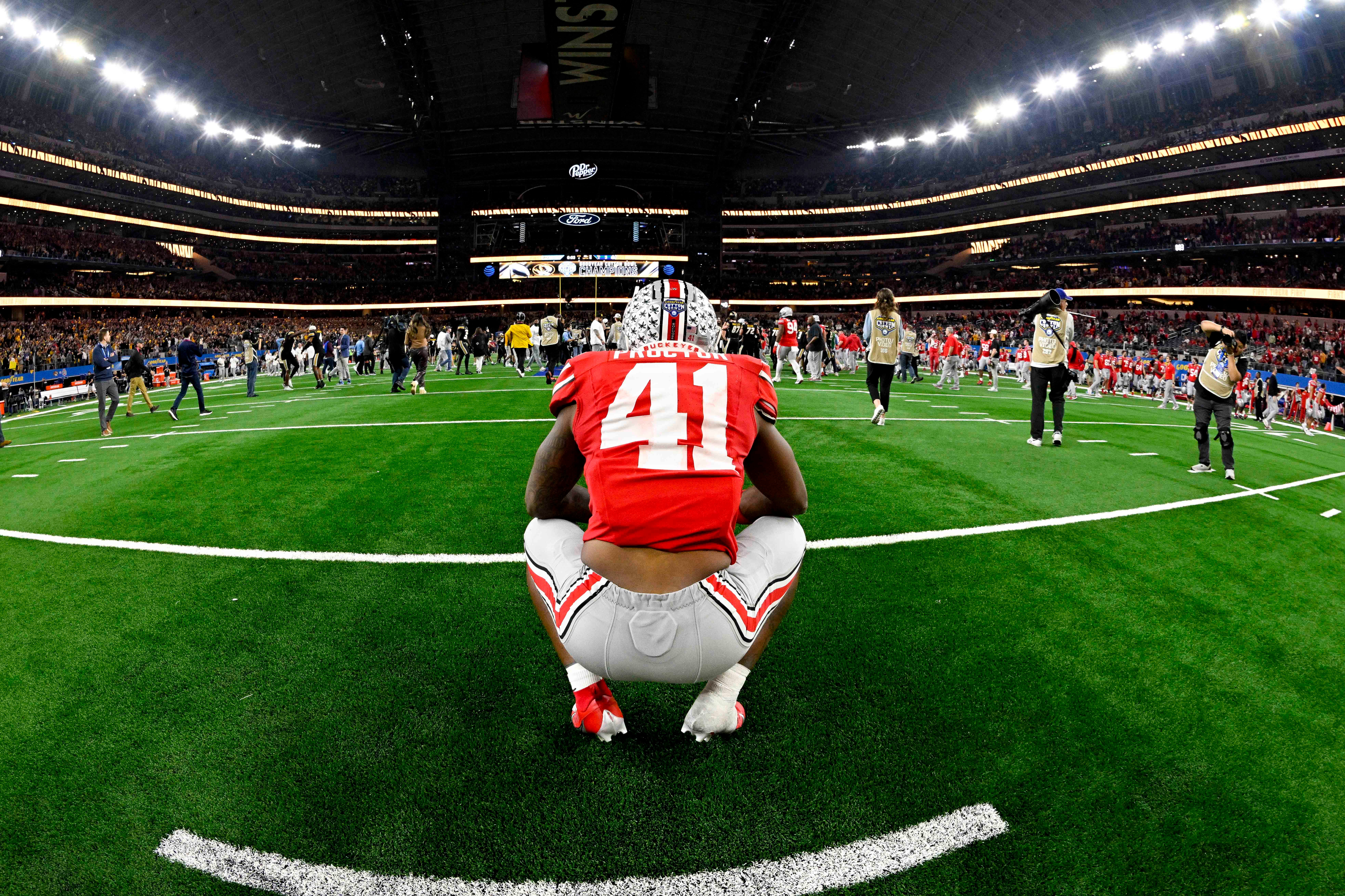 Dec 29, 2023; Arlington, TX, USA; Ohio State Buckeyes safety Josh Proctor (41) watches the Missouri Tigers celebrate after the Tigers defeat the Ohio State Buckeyes at AT&T Stadium.