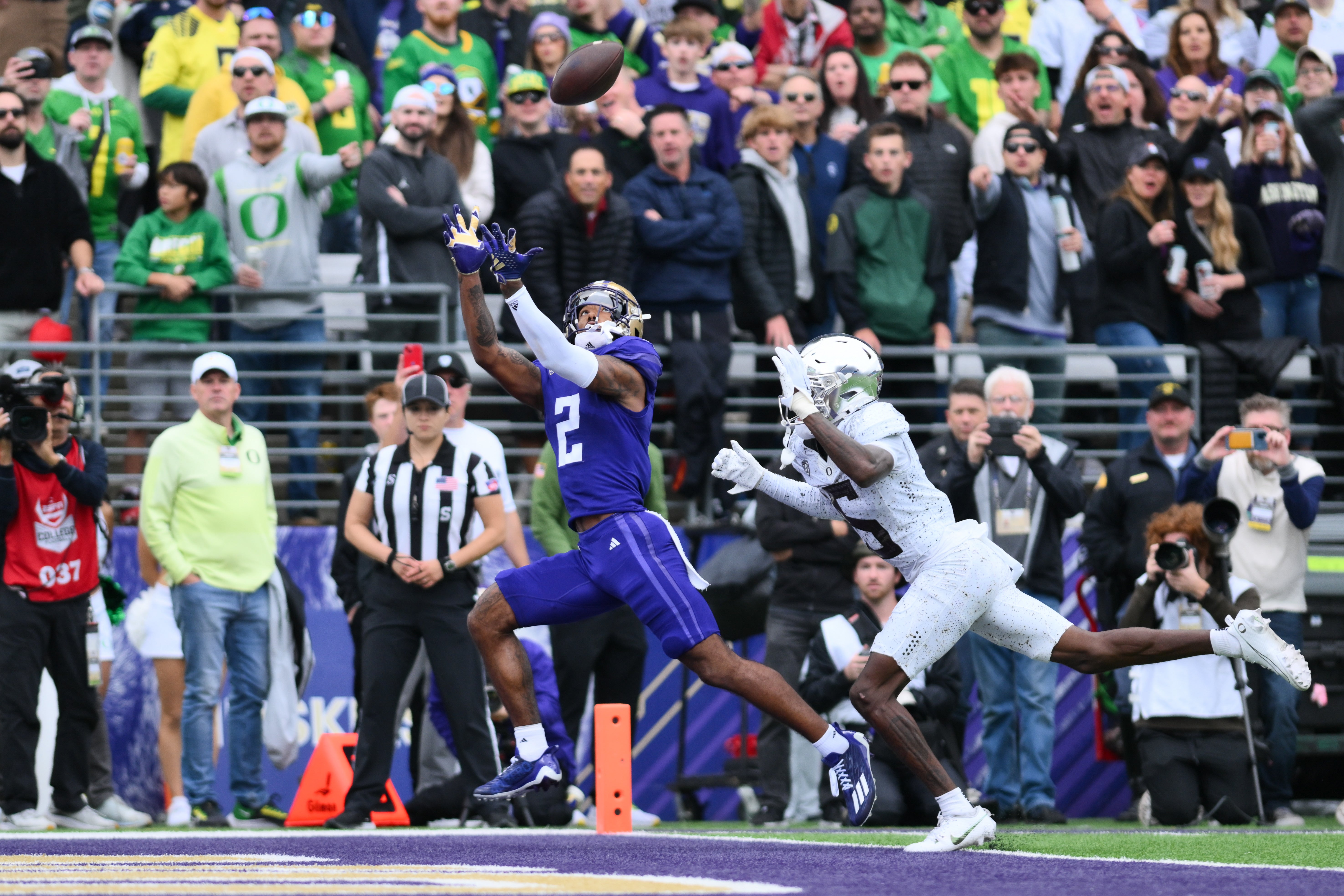 Oct 14, 2023; Seattle, Washington, USA; Washington Huskies wide receiver Ja'Lynn Polk (2) catches a pass for a touchdown against the Oregon Ducks during the first half at Alaska Airlines Field at Husky Stadium.
