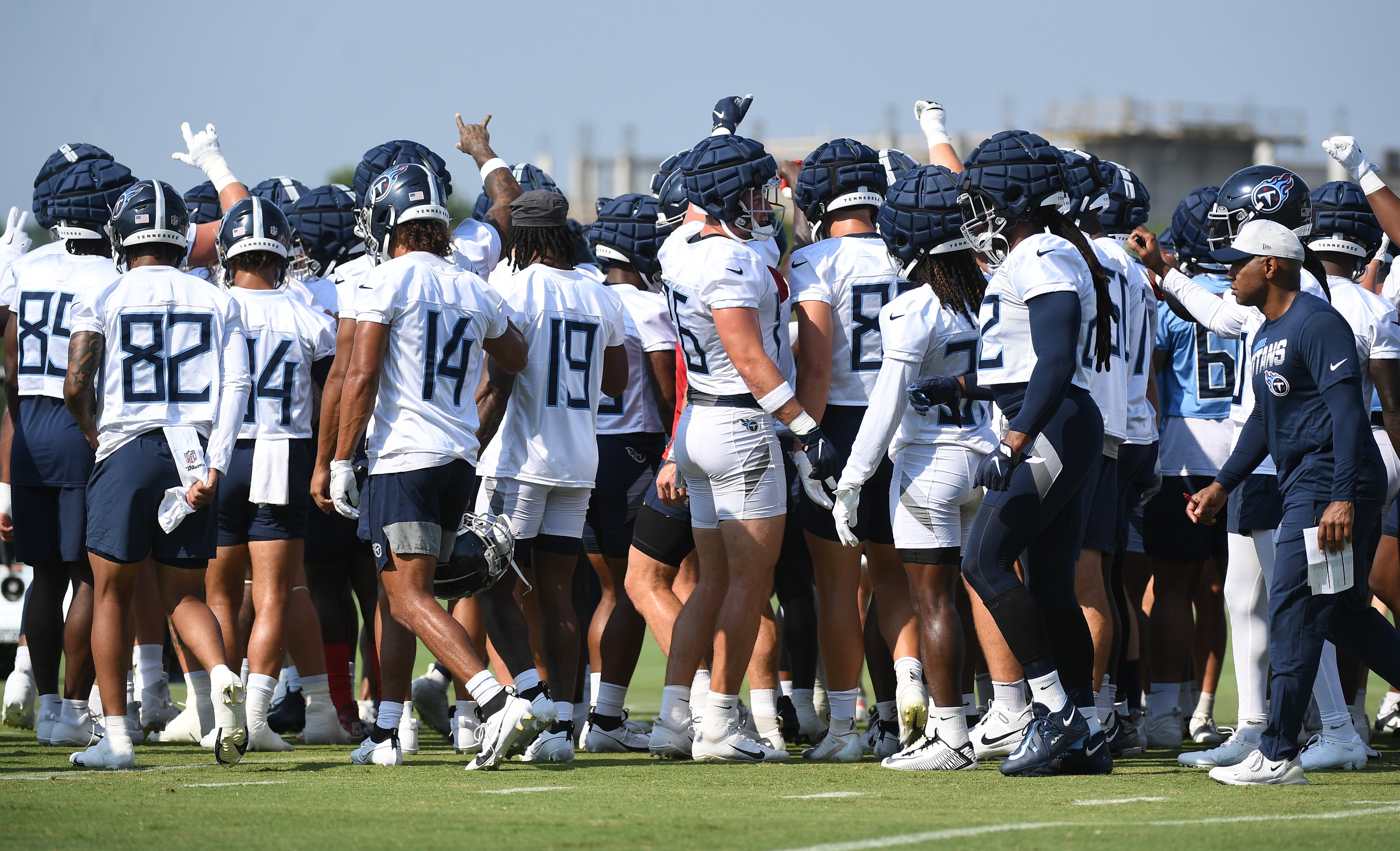 Tennessee Titans players huddle after stretching before the start of training camp. Christopher Hanewinckel-USA TODAY Sports