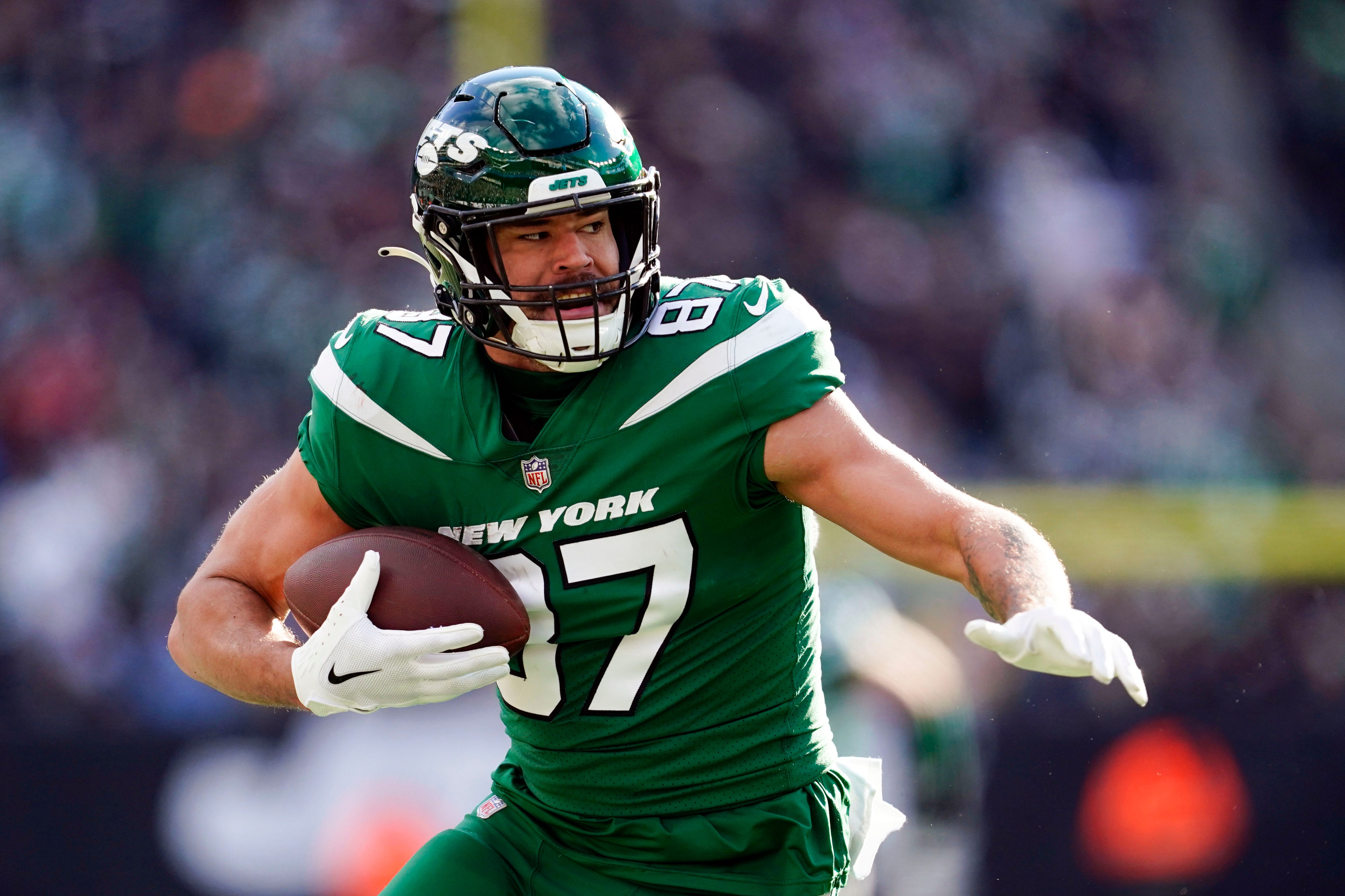 New York Jets tight end C.J. Uzomah (87) scores a touchdown against the Detroit Lions in the first half at MetLife Stadium on Sunday, Dec. 18, 2022.