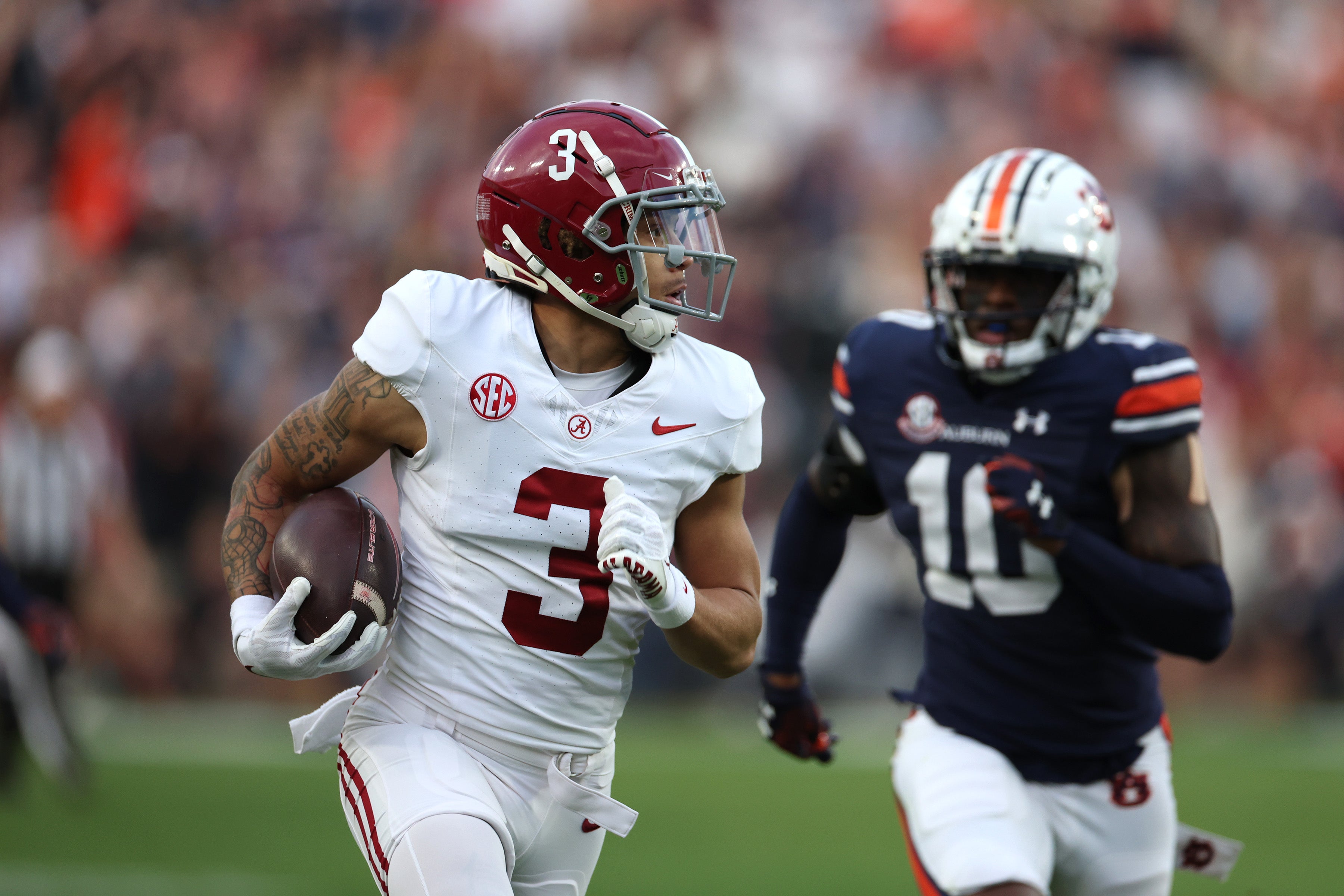 Nov 25, 2023; Auburn, Alabama, USA; Alabama Crimson Tide wide receiver Jermaine Burton (3) carries for a touchdown during the second quarter against the Auburn Tigers at Jordan-Hare Stadium. Mandatory Credit: John Reed-USA TODAY Sports