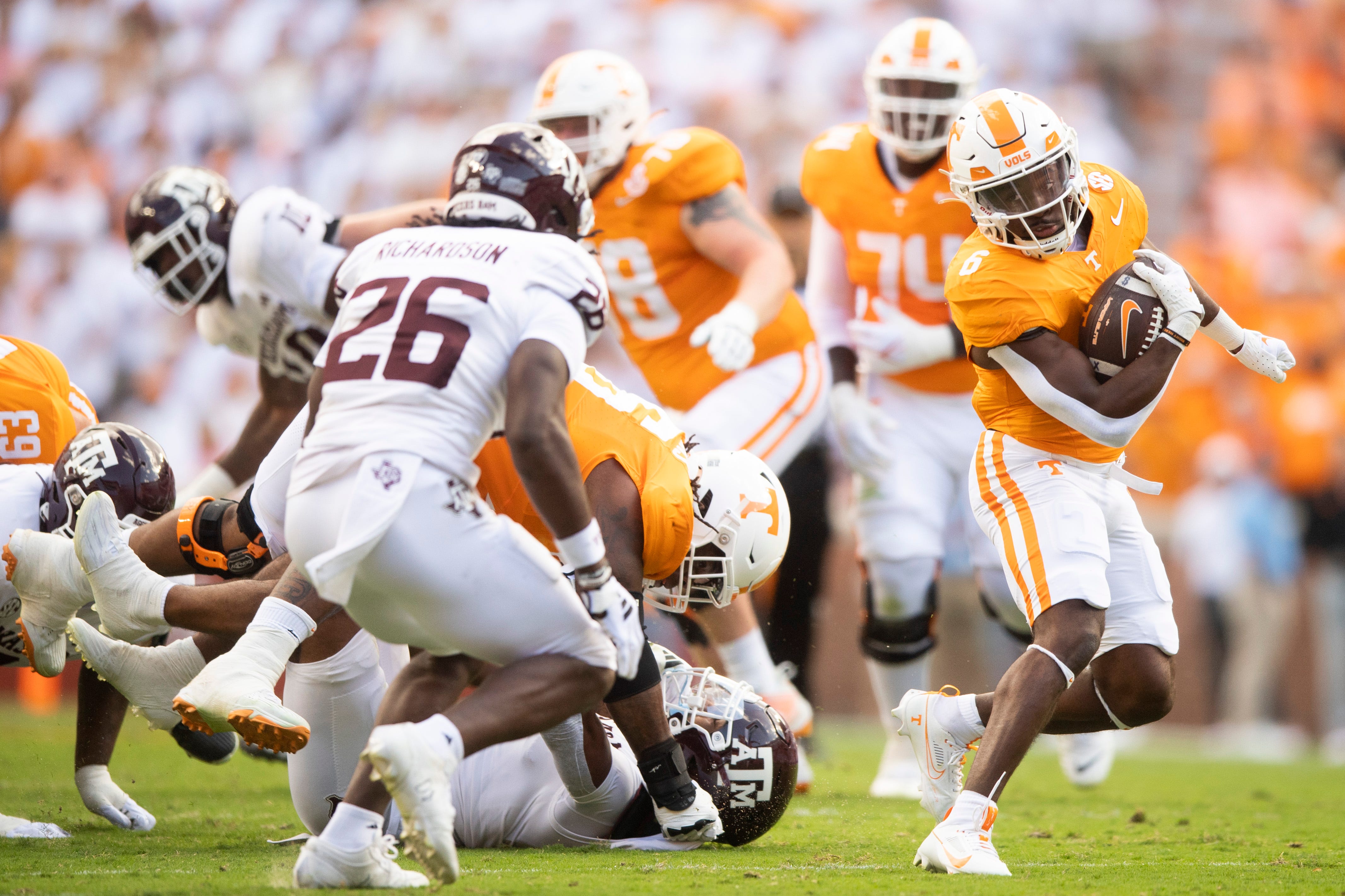Tennessee running back Dylan Sampson (6) dodges tackles during a football game between Tennessee and Texas A&M at Neyland Stadium in Knoxville, Tenn., on Saturday, Oct. 14, 2023.