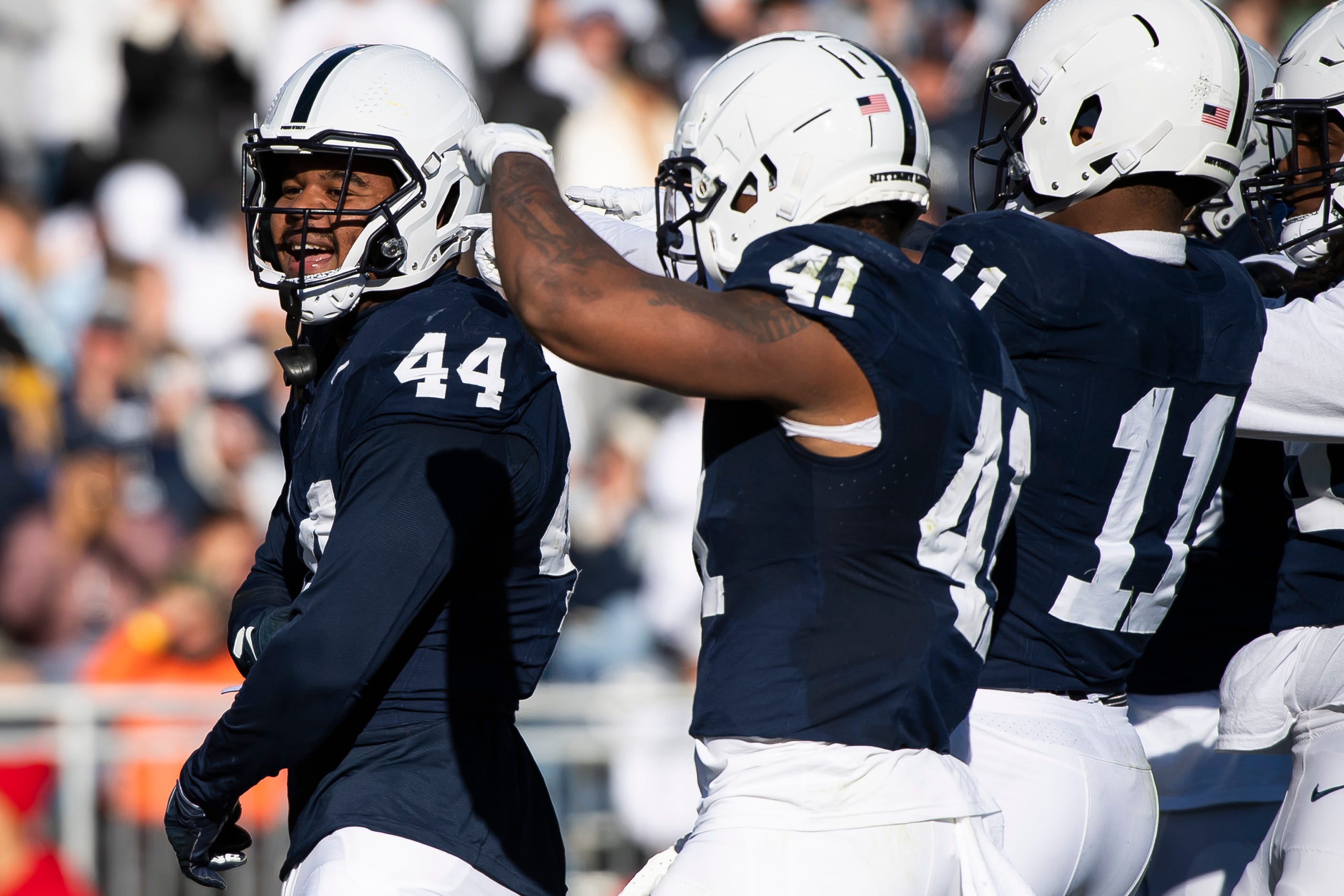 Penn State's Chop Robinson (44) celebrates with his teammates after recording a tackle for loss in the second half of an NCAA football game against Rutgers Saturday, Nov. 18, 2023, in State College, Pa. The Nittany Lions won, 27-6.