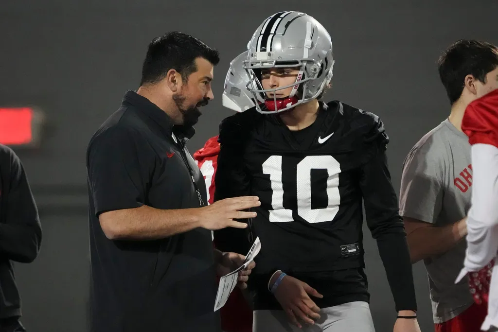Ohio State Buckeyes head coach Ryan Day talks to quarterback Julian Sayin (10) during spring football practice at the Woody Hayes Athletic Center