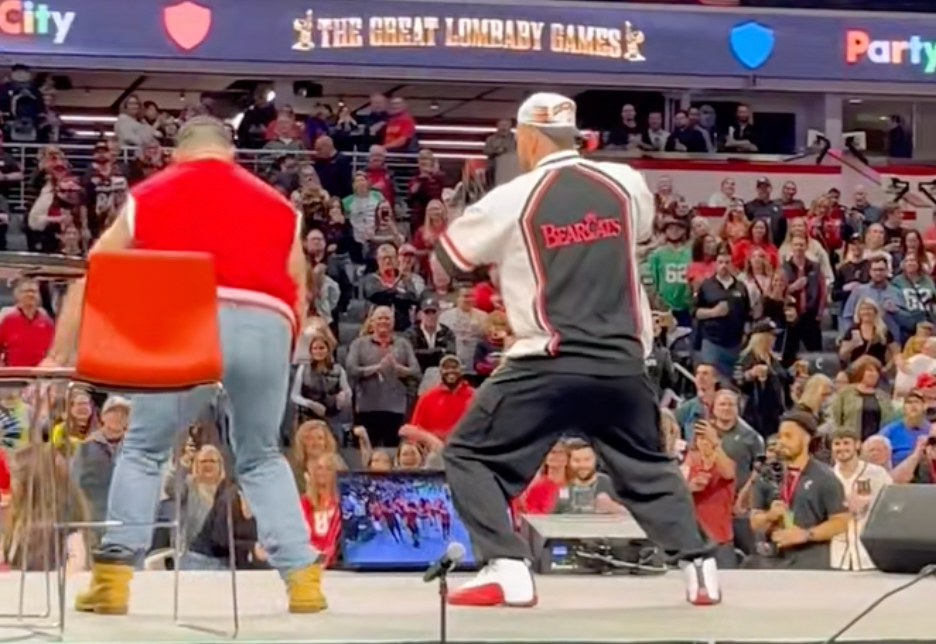 Travis and Jason Kelce dance during their live New Heights show at the University of Cincinnati.