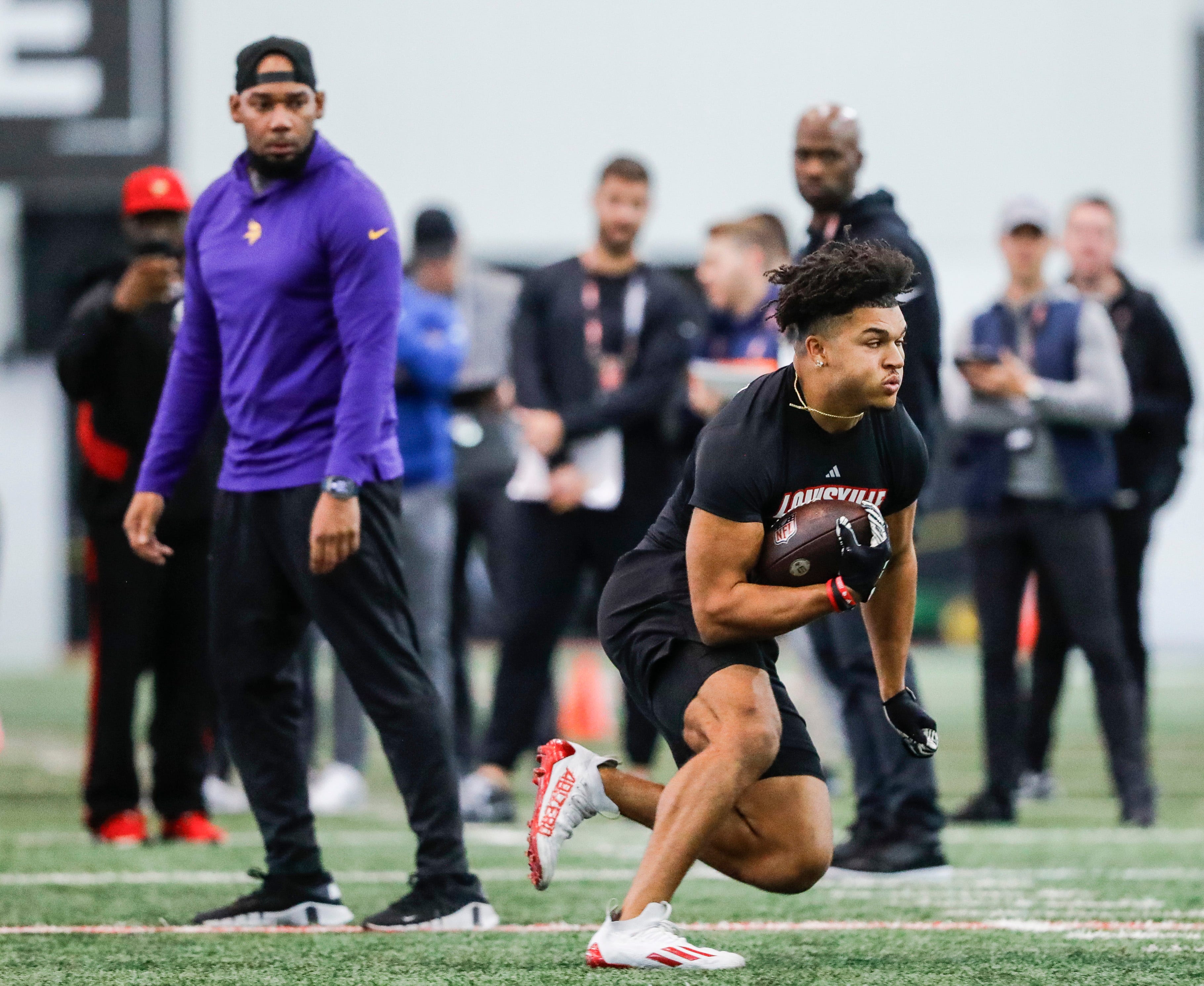 Louisville Cardinals senior running back Isaac Guerendo works out under the eyes of NFL scouts on Pro Day Tuesday morning. NFL scouts from several teams were evaluating Cardinal players. March 26, 2024