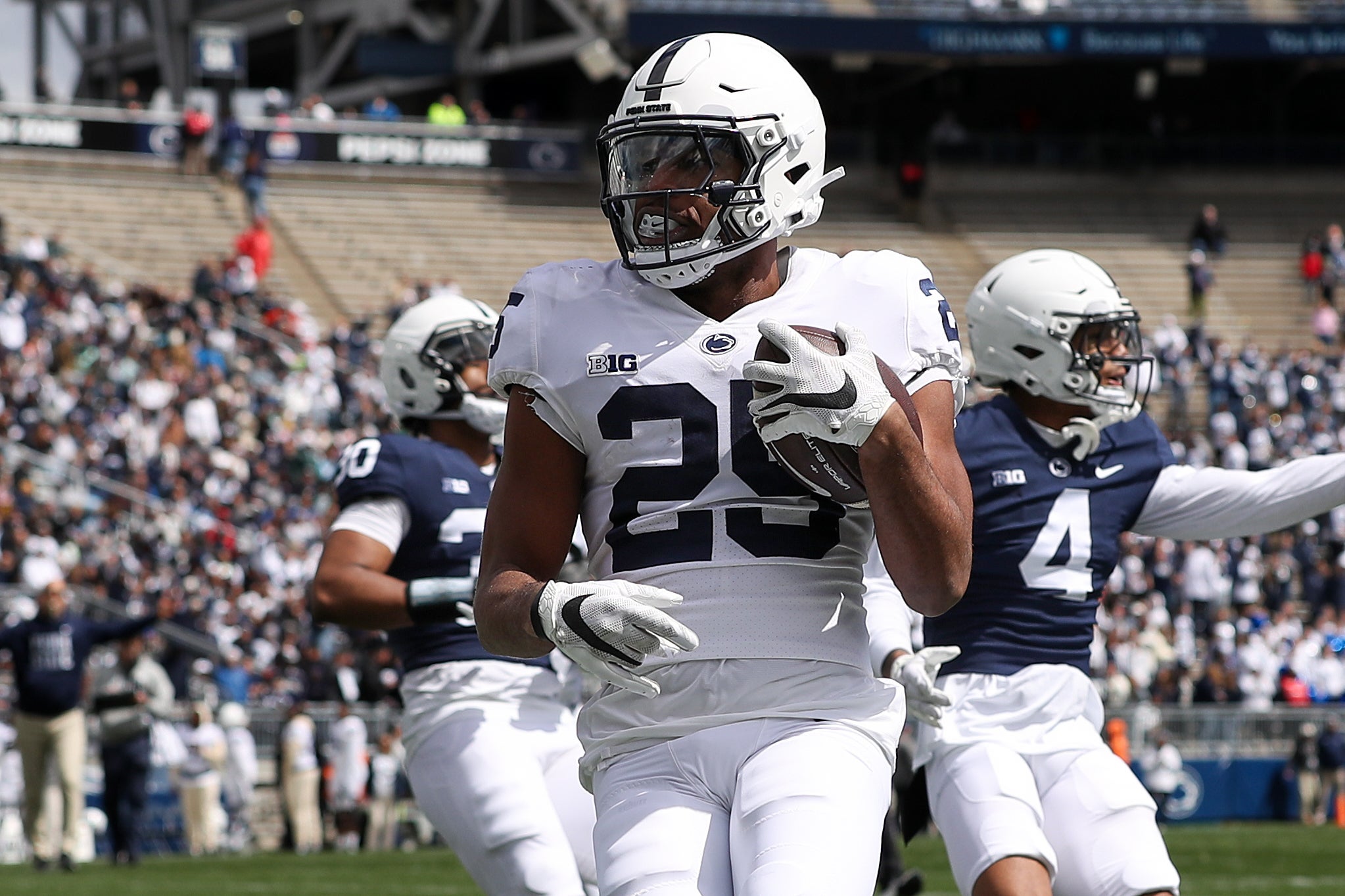 Apr 13, 2024; University Park, PA, USA; Penn State Nittany Lions running back Quinton Martin Jr (25) runs the ball into the end zone for a touchdown during the second quarter of the Blue White spring game at Beaver Stadium. The White team defeated the Blue team 27-0.