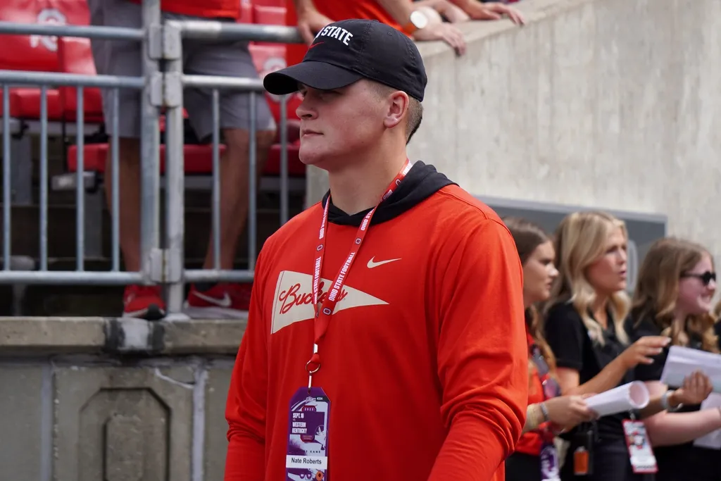 Nate Roberts, a 2025 tight end prospect out of Washington, Oklahoma, speaks with OSU coach Ryan Day prior to the Buckeyes' game against Western Kentucky on Sept. 16, 2023