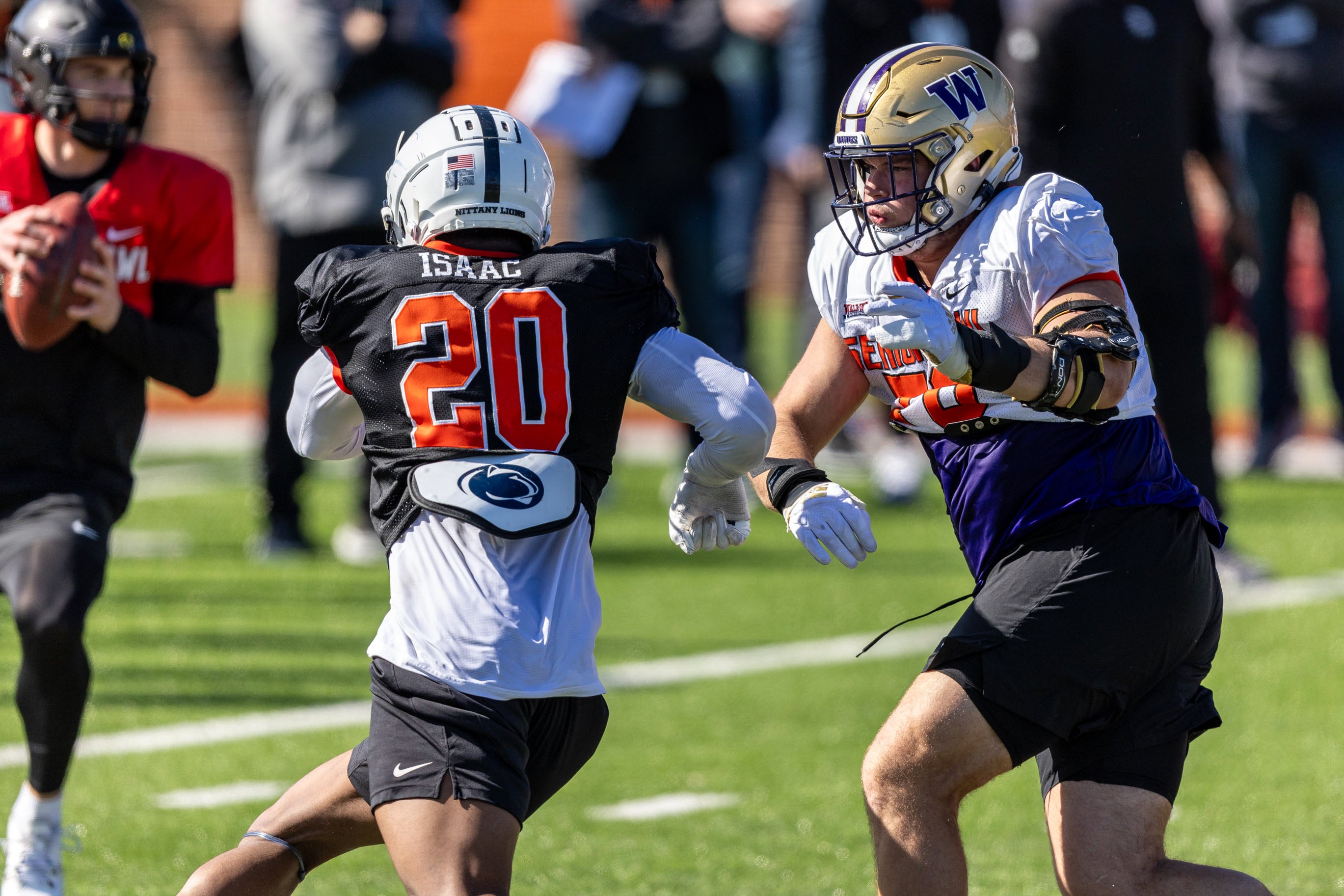 Jan 30, 2024; Mobile, AL, USA; National edge Adisa Isaac of Penn State (20) pressures National offensive lineman Roger Rosengarten of Washington (76) during practice for the National team at Hancock Whitney Stadium.