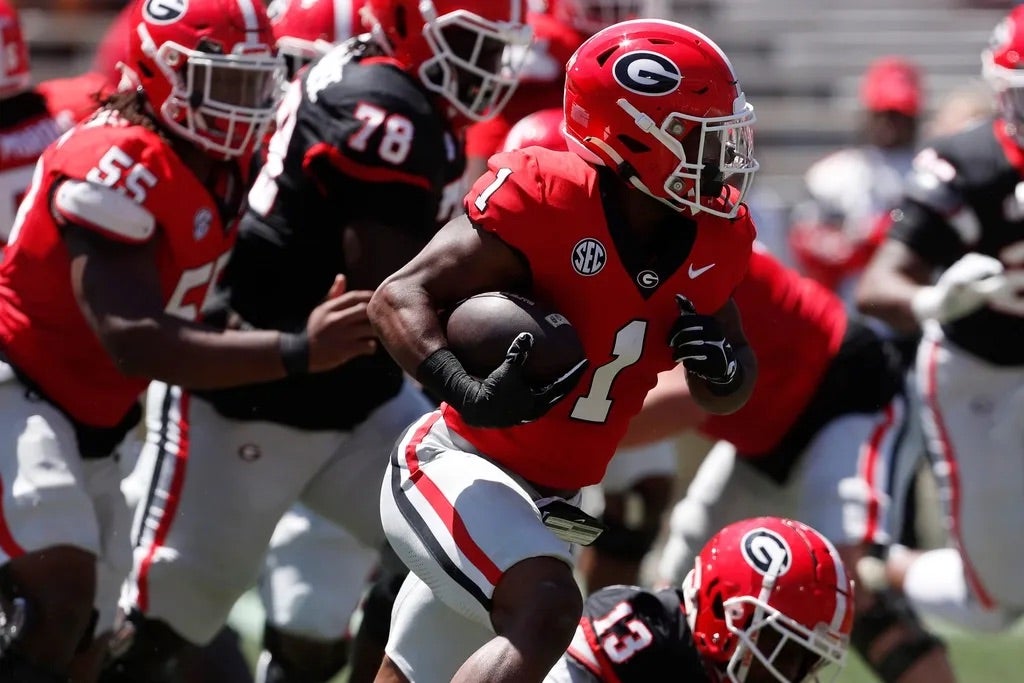 Georgia running back Trevor Etienne (1) moves the ball down the field during the G-Day spring football game in Athens, Ga., on Saturday, April 13, 2024.