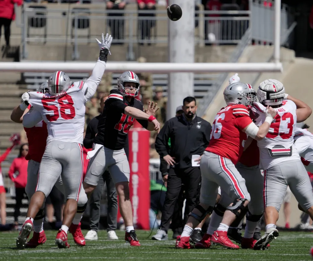Ohio State Buckeyes quarterback Will Howard (18) thorws a pass while playing for the scarlet team during the first half of the LifeSports spring football game at Ohio Stadium on Saturday