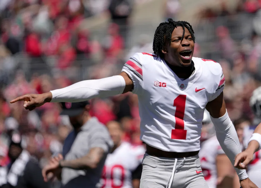 Ohio State Buckeyes cornerback Davison Igbinosun (1) of the grey team yells from the sideline during the second half of the LifeSports spring football game at Ohio Stadium on Saturday