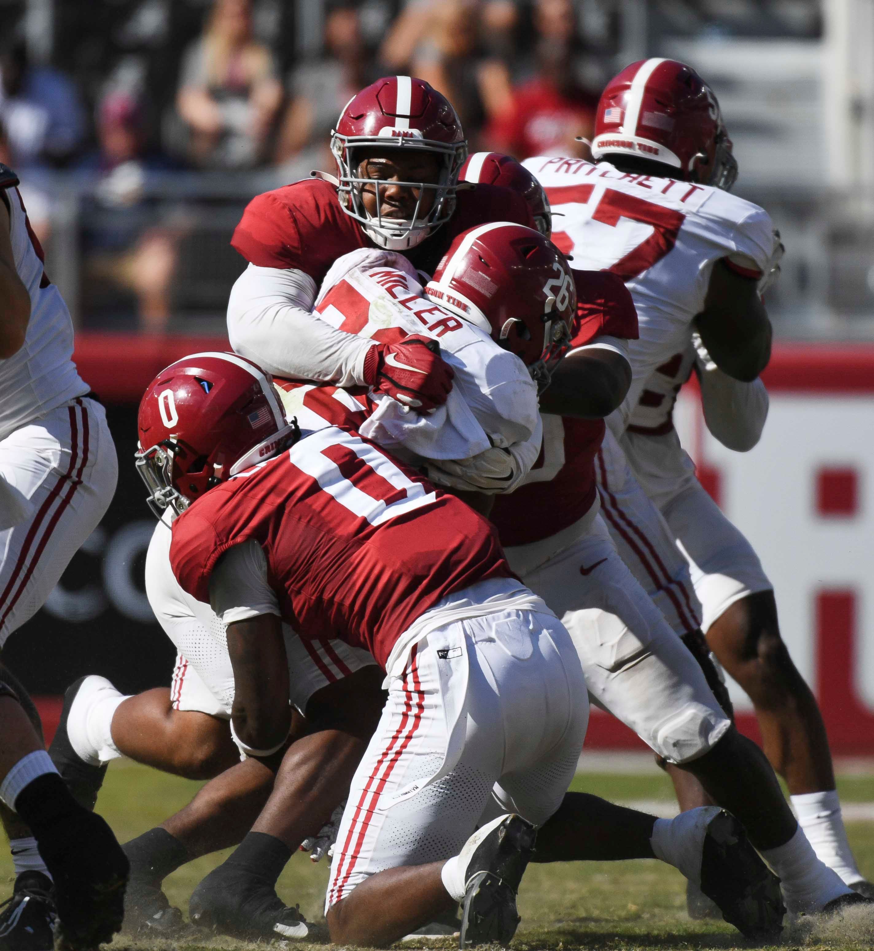 Apr 13, 2024; Tuscaloosa, AL, USA; Alabama defensive lineman Damon Payne Jr. (44) and Alabama linebacker Deontae Lawson (0) combine to tackle Alabama running back Jam Miller (26) at Bryant-Denny Stadium.