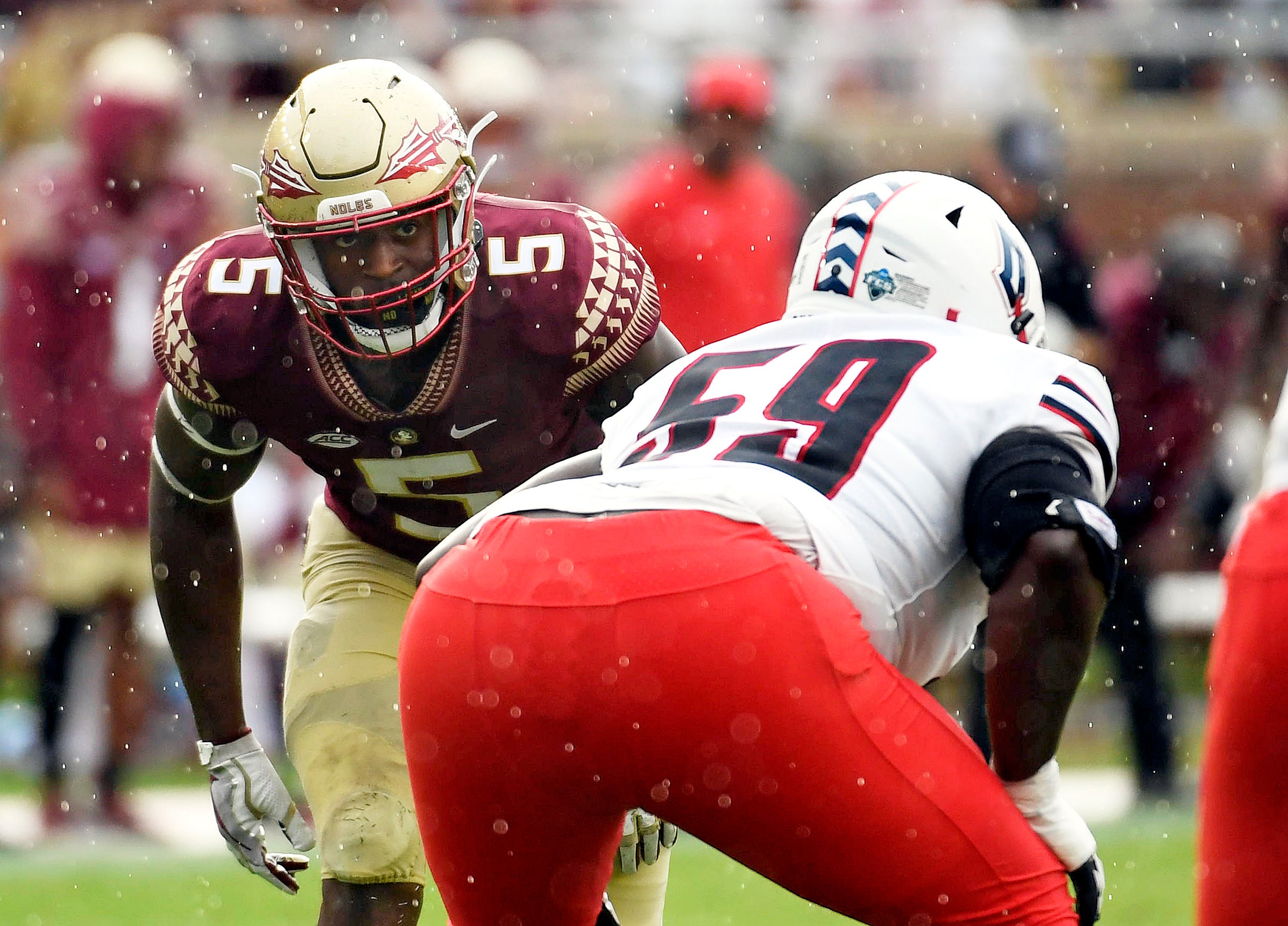 Aug 27, 2022; Tallahassee, Florida, USA; Florida State Seminoles defensive end Jared Verse (5) lines up against Duquesne Dukes offensive lineman Chris Oliver (59) during the first half at Doak S. Campbell Stadium. Mandatory Credit: Melina Myers-USA TODAY Sports